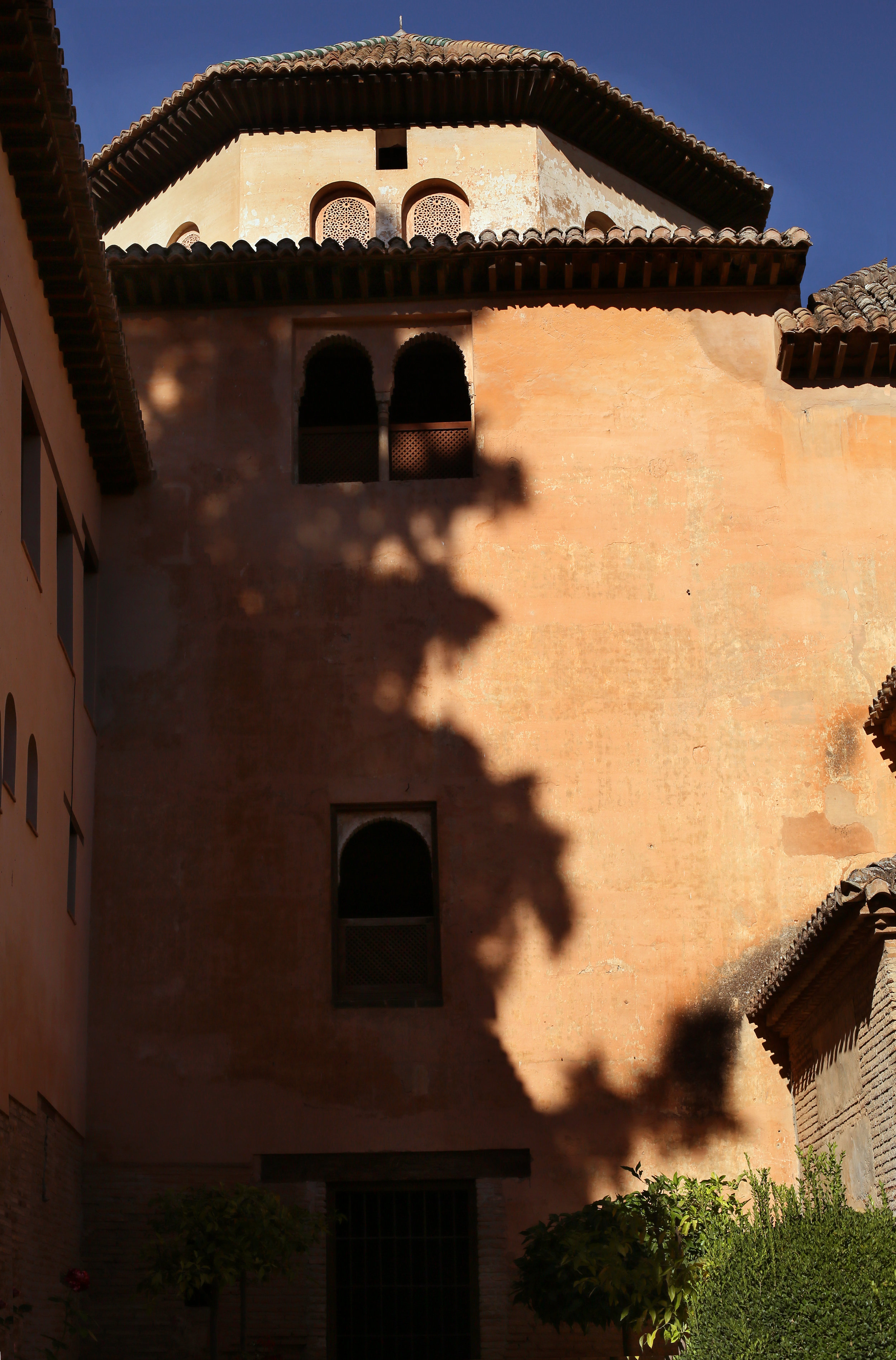 Famously, Queen Isabella (of Isabella and Ferdinand) initially intended to tear down all the Arabic texts and replace them with Catholic art, but after living among the beauty of the palace said, "I did not conquer the Alhambra, the Alhambra conquered me." She kept the Arabic inscriptions intact.