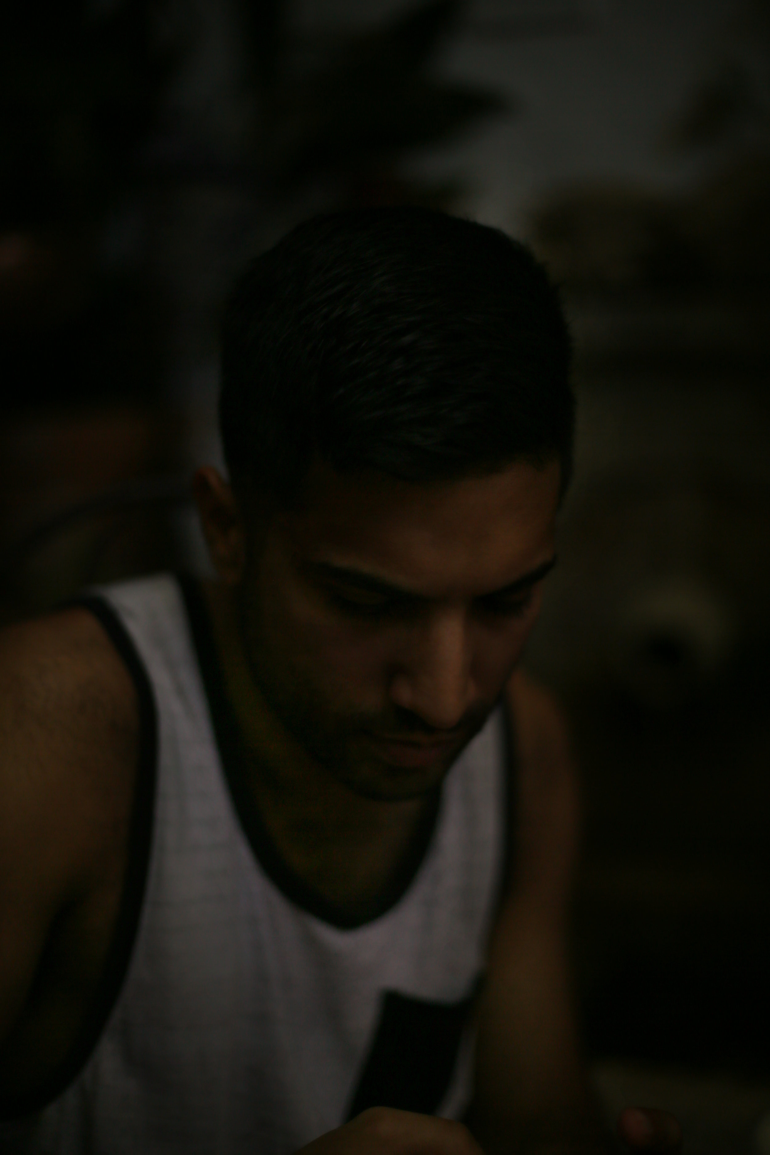 Low-light portrait of Umar at the surprisingly un-crowded courtyard restaurant in the Alhambra's cafe, where we ordered tomato and cheese bocadillos and espressos