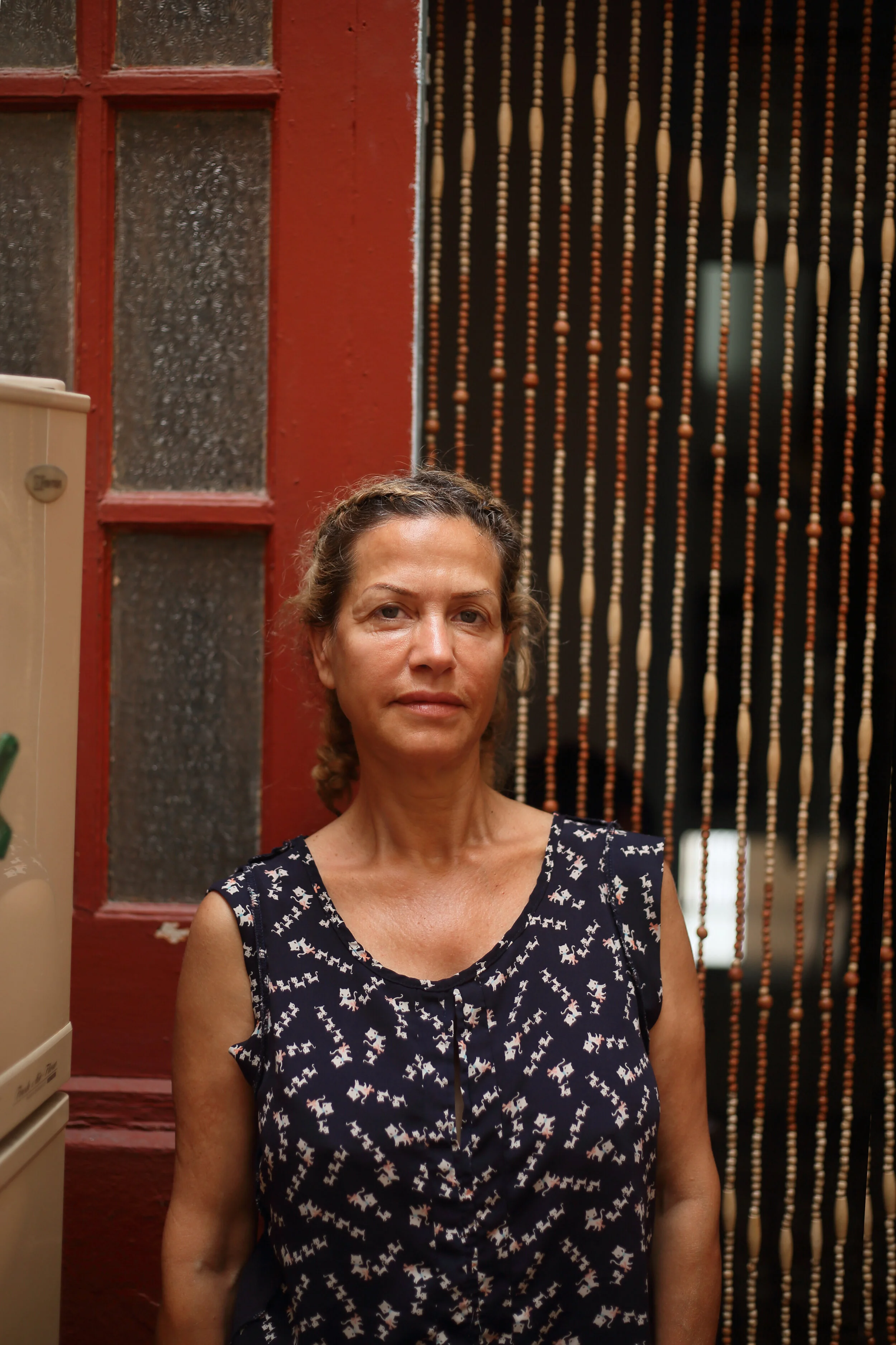 She sighed reluctantly when I asked her if I could take a photo. “I never like the way they turn out,” she said. “I look and I think, who is that?” “Challenge accepted,” I responded. She liked the results and let me take multiple shots.