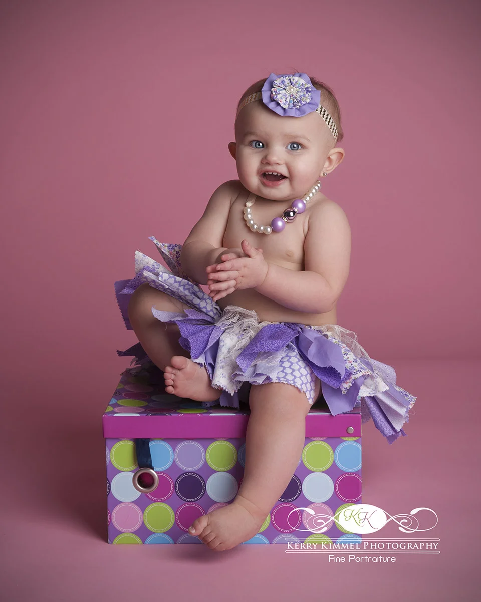 Such a doll in her purple tutu!