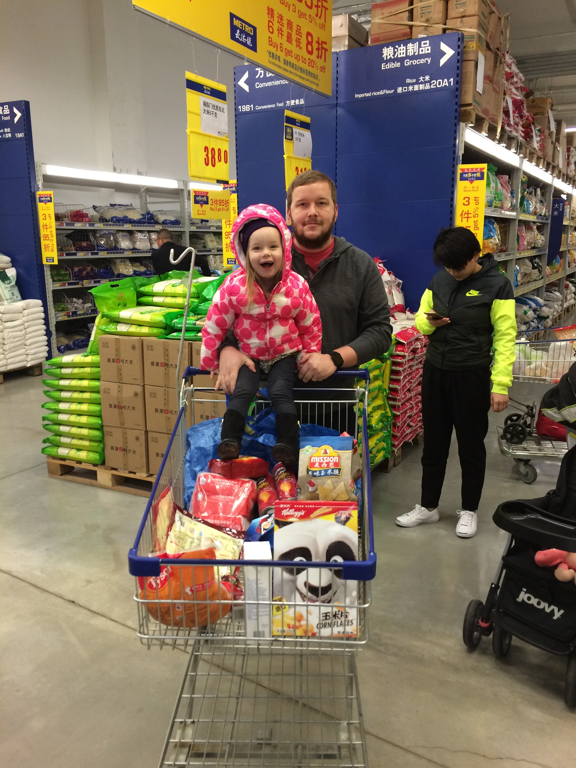 Abigail's first trip to the grocery store. They don't use heat in the stores so it was freezing!