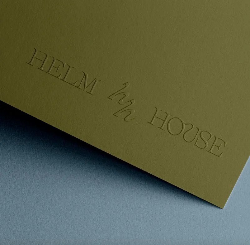 Embossed text on light yellow paper reads 'the HOUSE the' and 'HETREH' upside down.