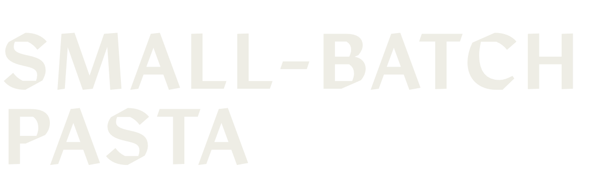 Text saying 'Small-Batch Pasta' in large, bold, light gray letters on a black background.