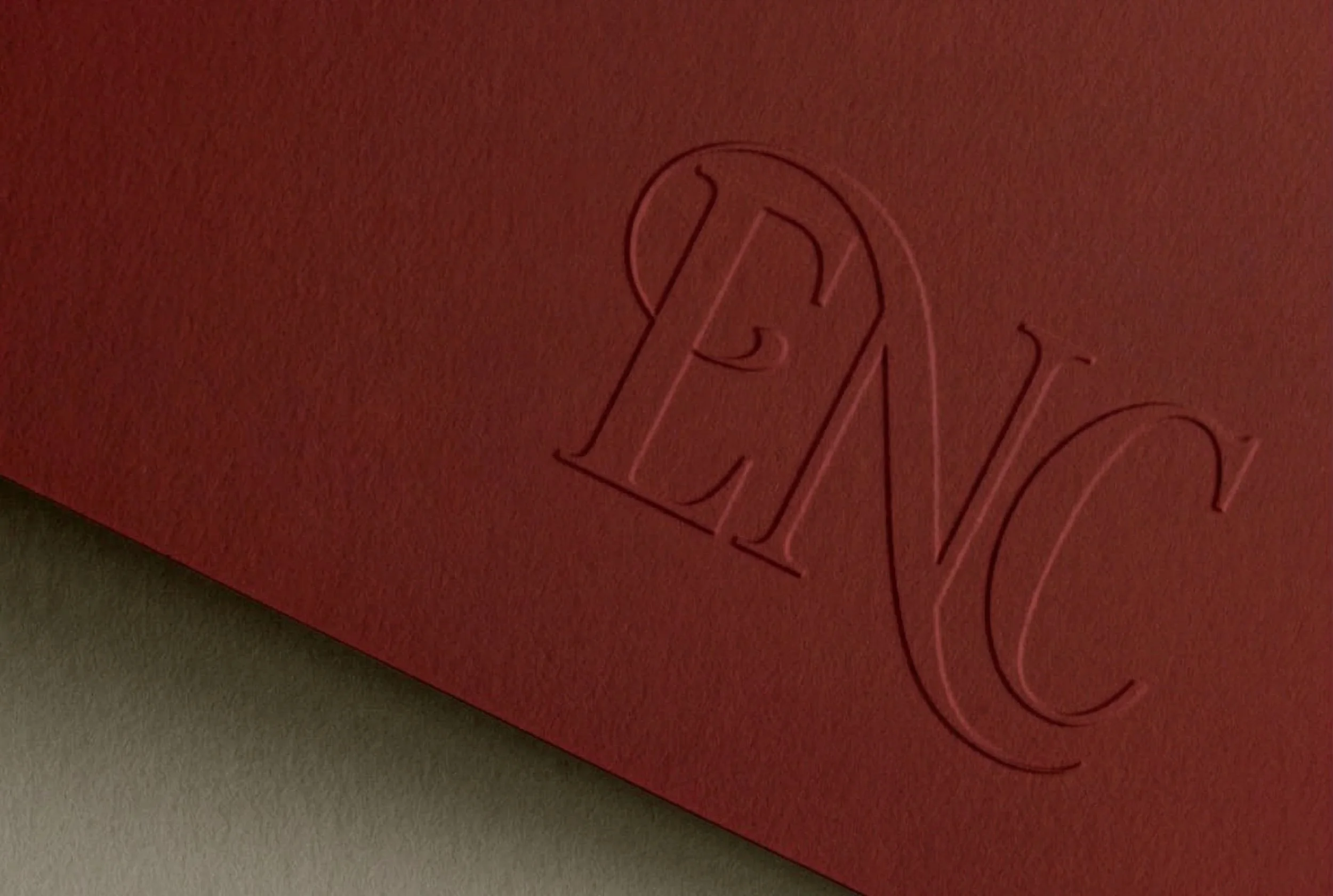 A close-up of a red surface with an outline of the word 'LOVE' in stylized letterings.