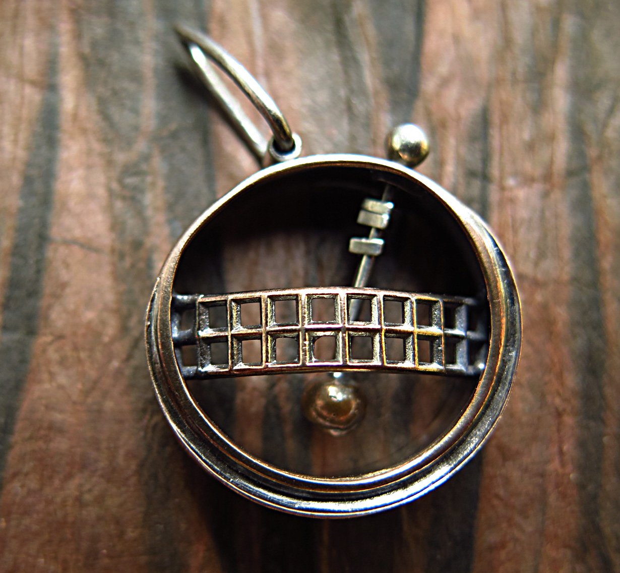 kinetic pendulum pendant
