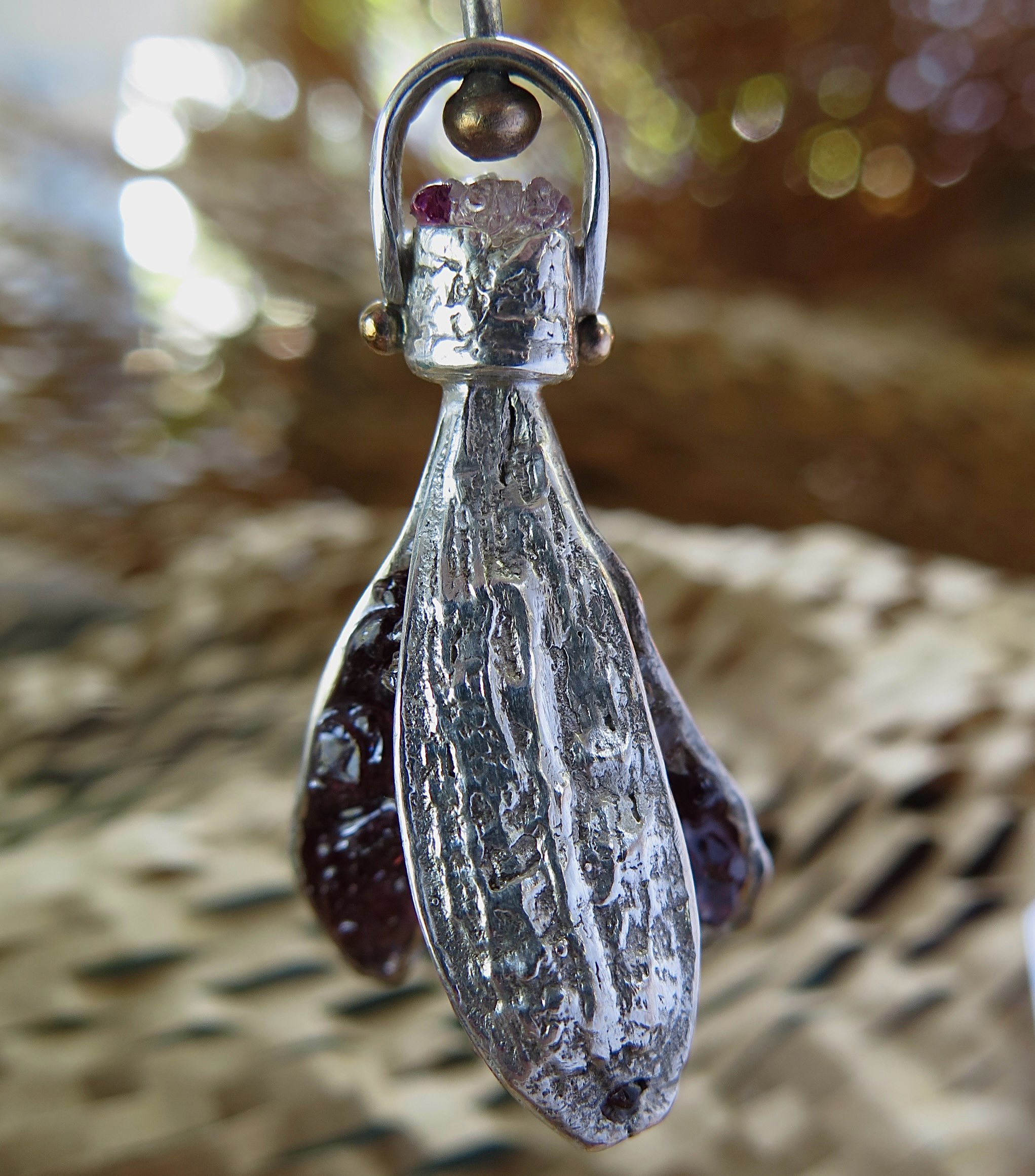 kinetic crushed gem filled pendant