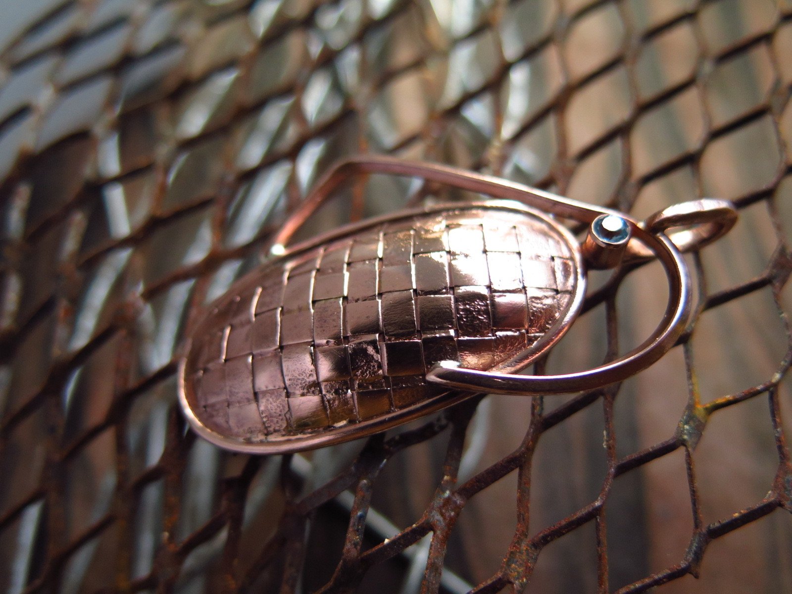 woven copper and resin oval pendant
