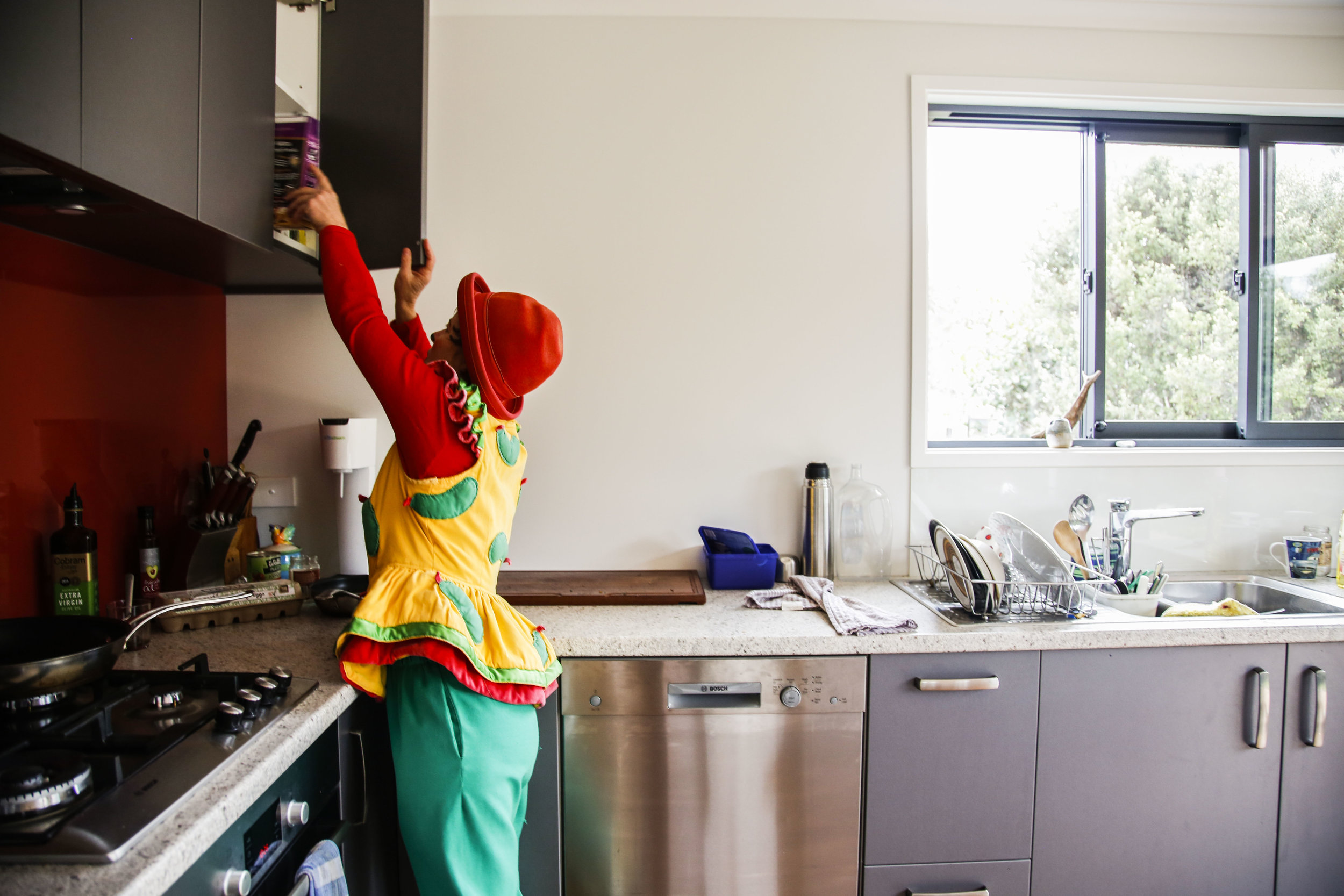  Lisa goes through her kitchen cupboard in her newly remodeled Christchurch, NZ home.&nbsp; 