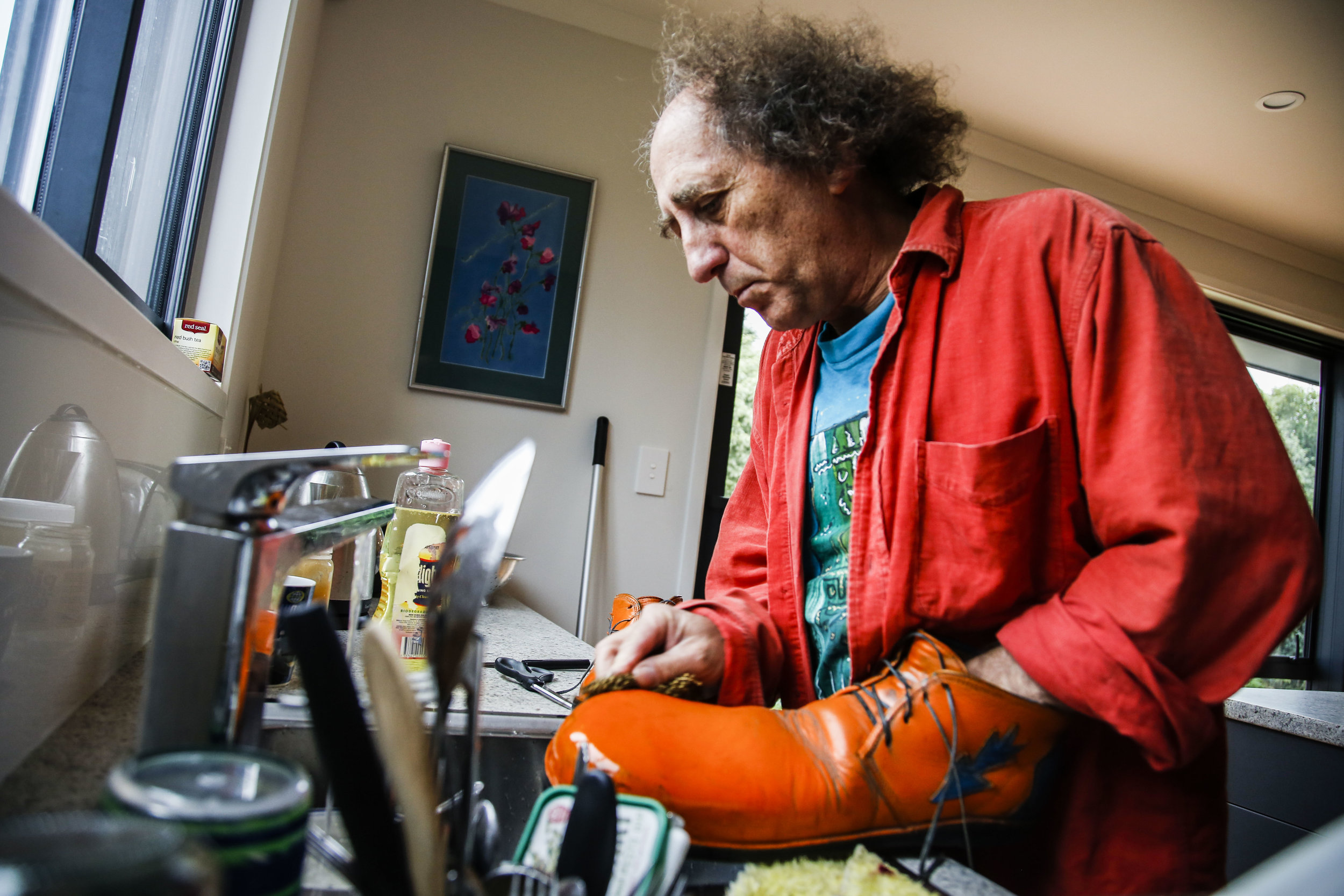  Chris Carrow washes his clown shoes in his Christchurch, NZ home on May 6, 2016 in preparation for his show with Wingfield at Rāwhiti School. "I guess clowning, in a way, is about truth. You have to be true to yourself and you have to be true to wha