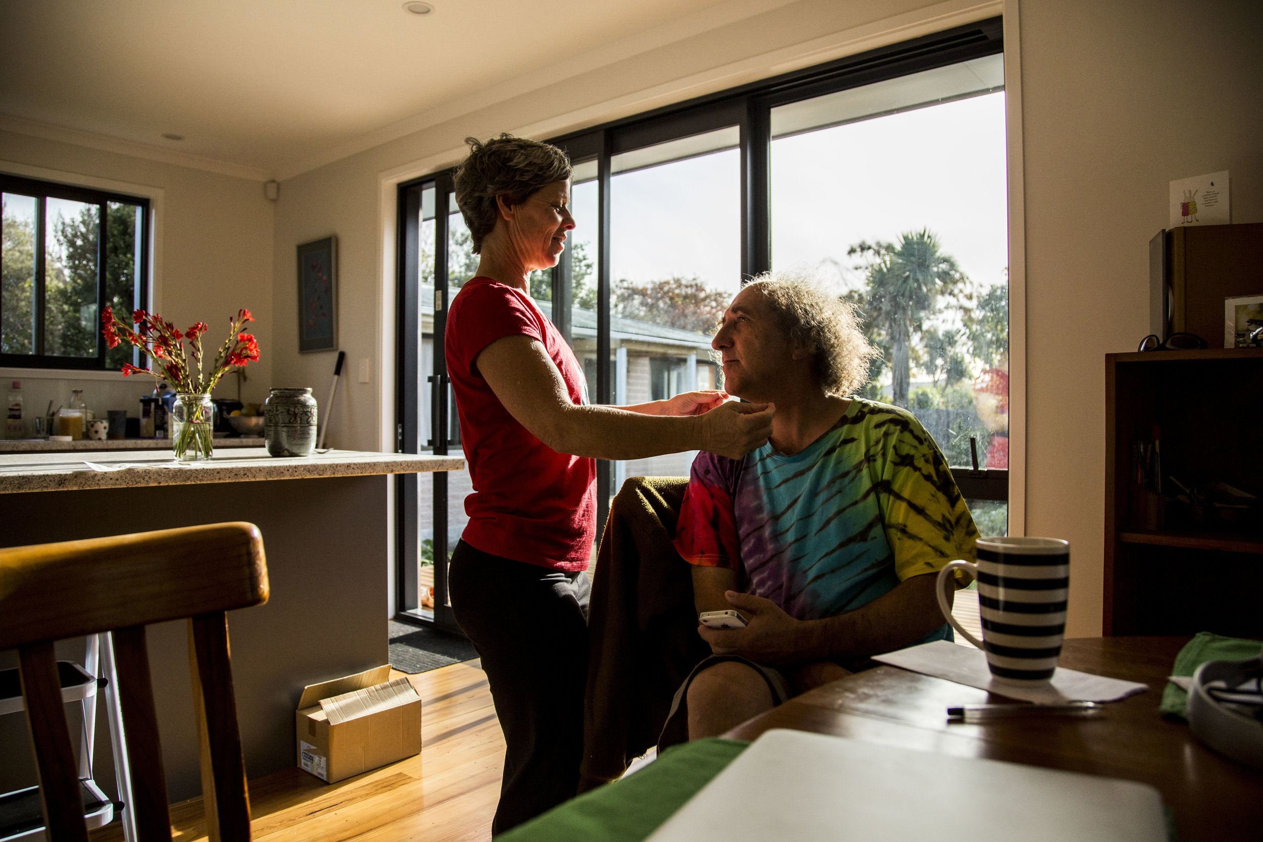  Wingfield (left) and Carrow (right) embrace in their Christchurch, NZ home on May 3, 2016. In addition to losing their circus school, their home was also destroyed in the aftermath of the earthquake. They've just recently finished rebuilding their h