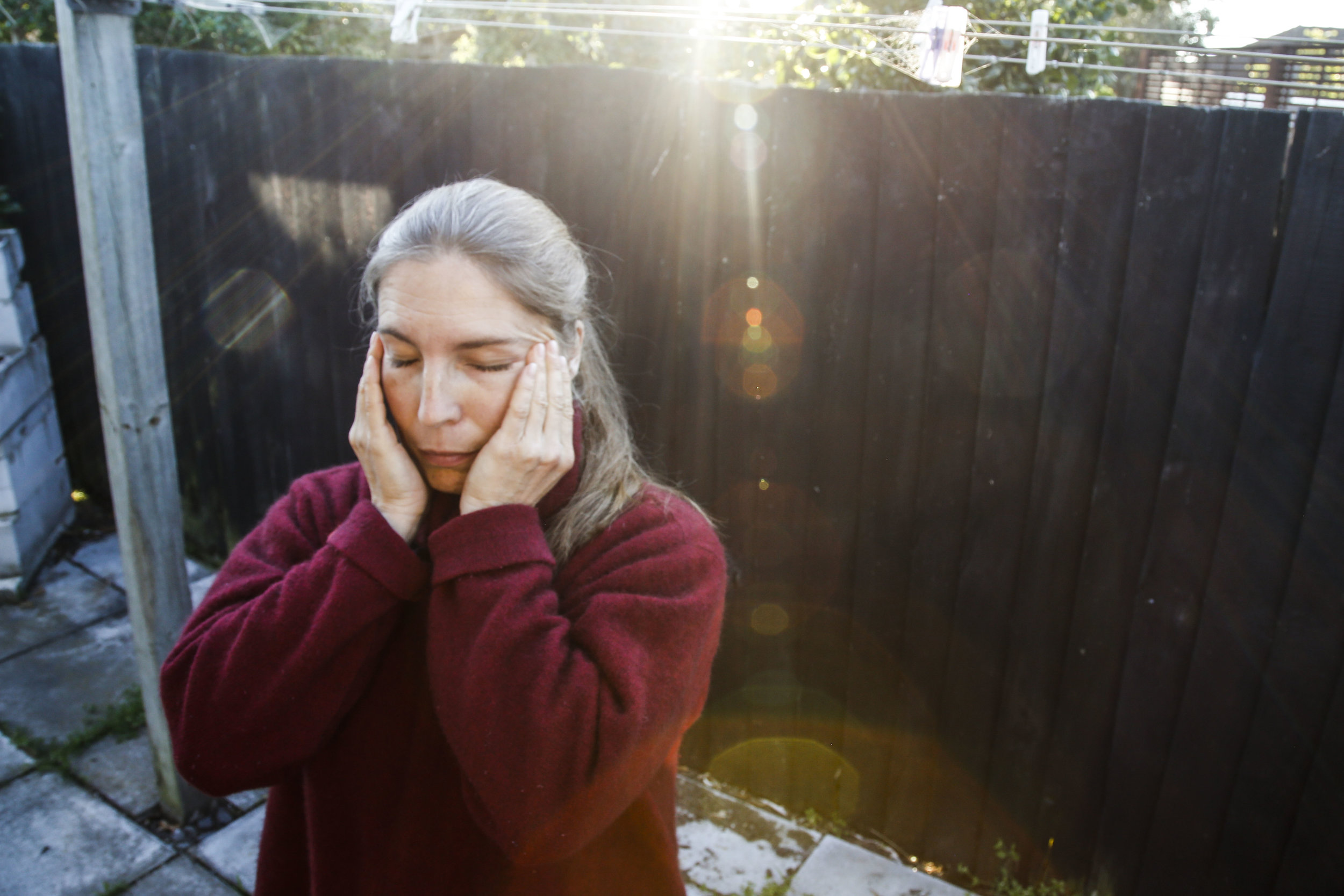  Olli closes her eyes for a moment in between portraits at her Christchurch, NZ home. "I was depressed for 16 years on and off without me knowing it or being able to label it as depression. Getting the emotional help that I needed and not taking myse