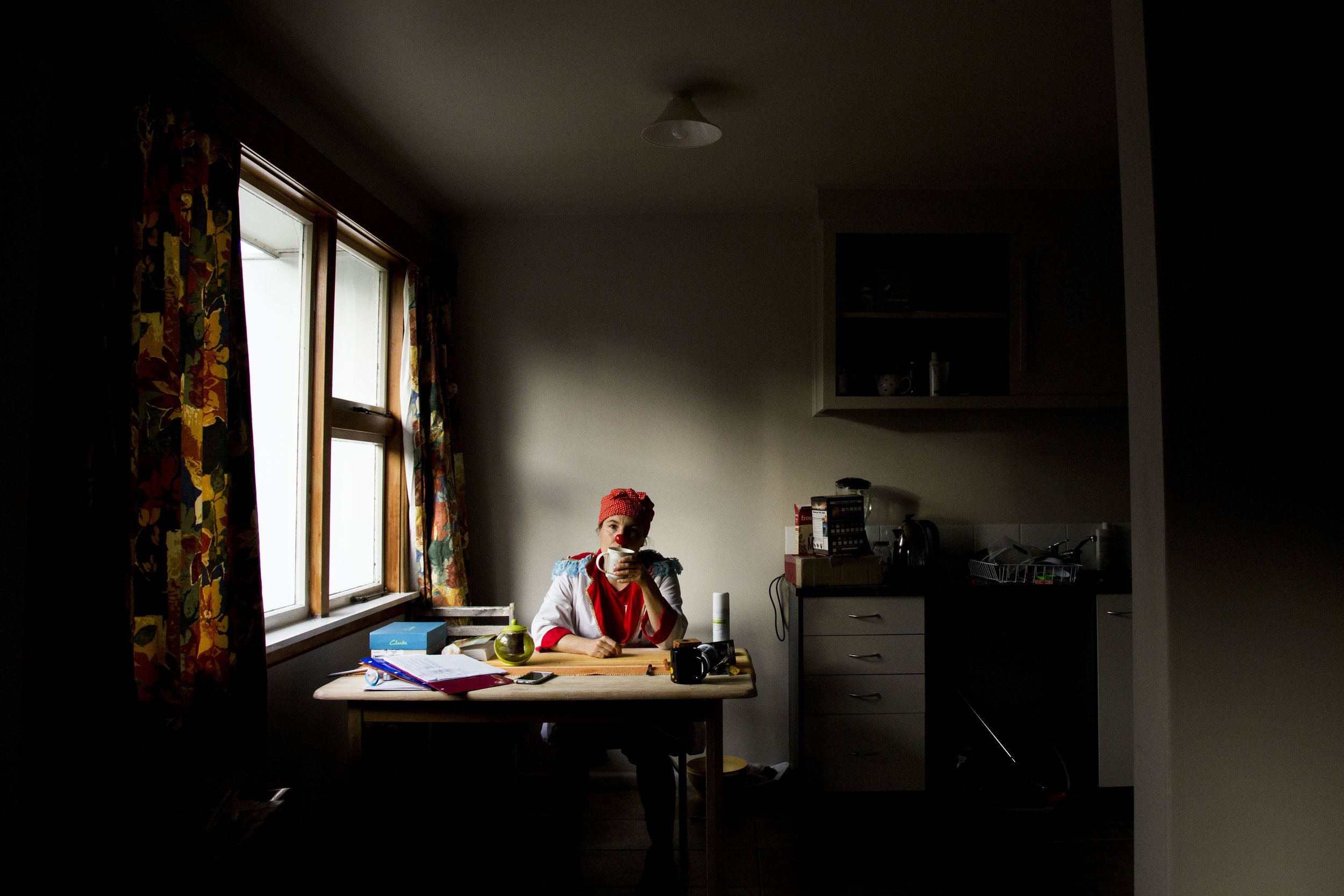  Ricken poses for a portrait in her Christchurch, NZ home while wearing her Clown Doctor costume on May 3, 2016. "Through my line of work, I have the privilege of dealing with lightness. I don’t have to deal with destruction. Although it’s been extre