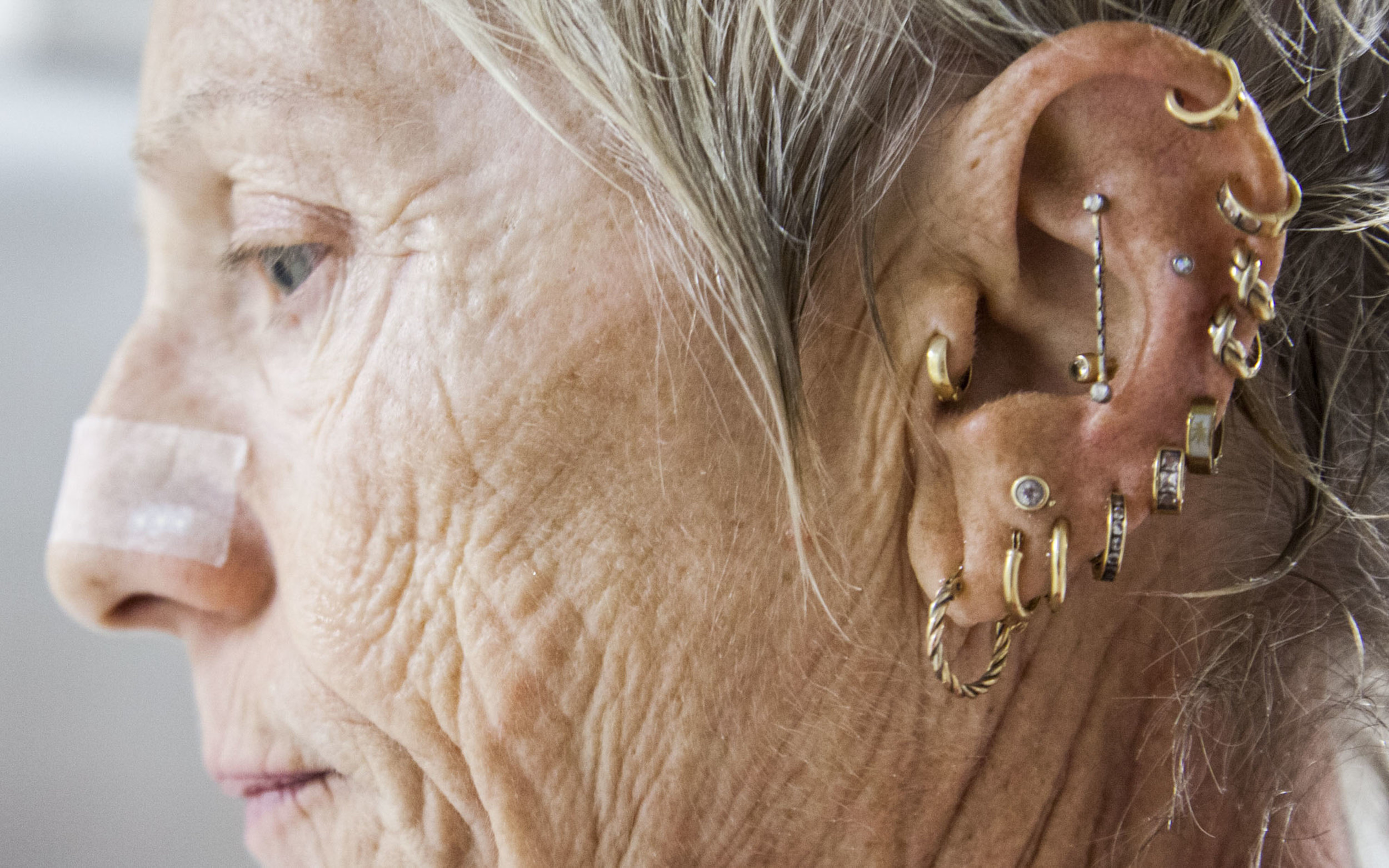  Sue Ketterer shows off her piercings during the 2015 National Senior Games swim meet. This swim meet took place at the University of Minnesota's Aquatic Center on July 4th, 2015. 