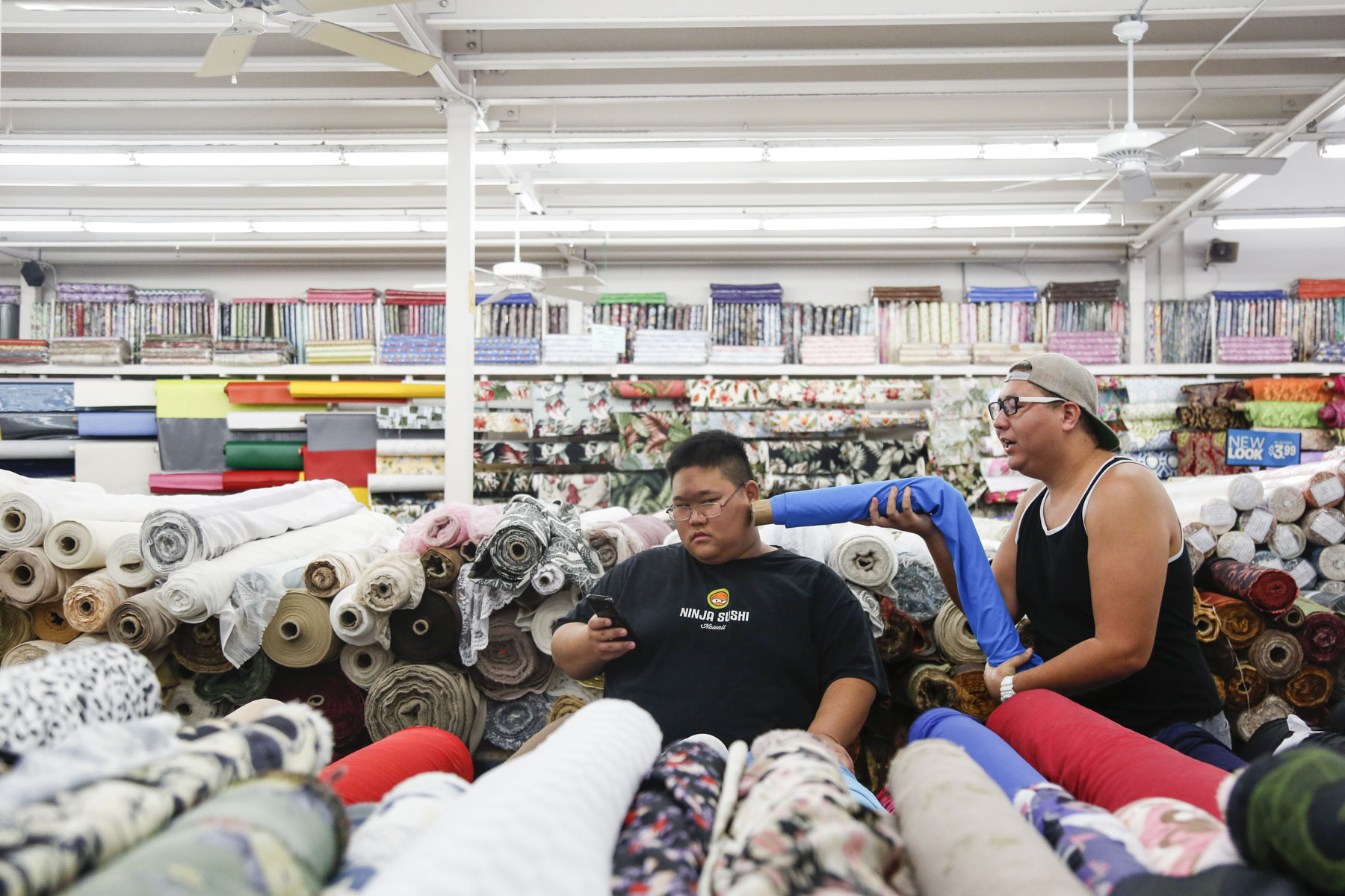  The Fruity Queens shop for fabric together at Fabric Mart in Aiea, HI. Water Melone (left), otherwise known as Keone Oka, hasn't fully come out to her family yet and keeps all of her drag attire/accessories at Apple Aday's, otherwise known as Tim Ke