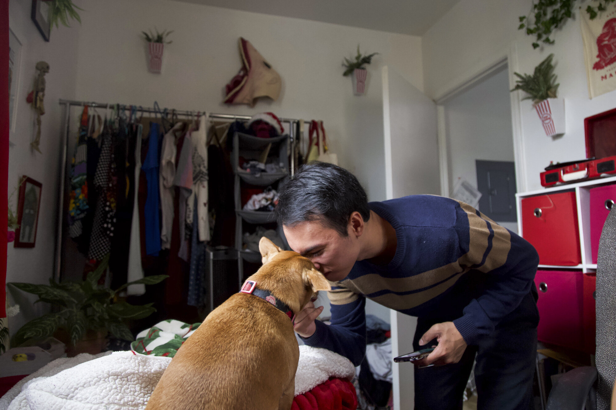  My brother kisses our beloved dog, Big “Biggie” Puppa, as she sits on my bed.  