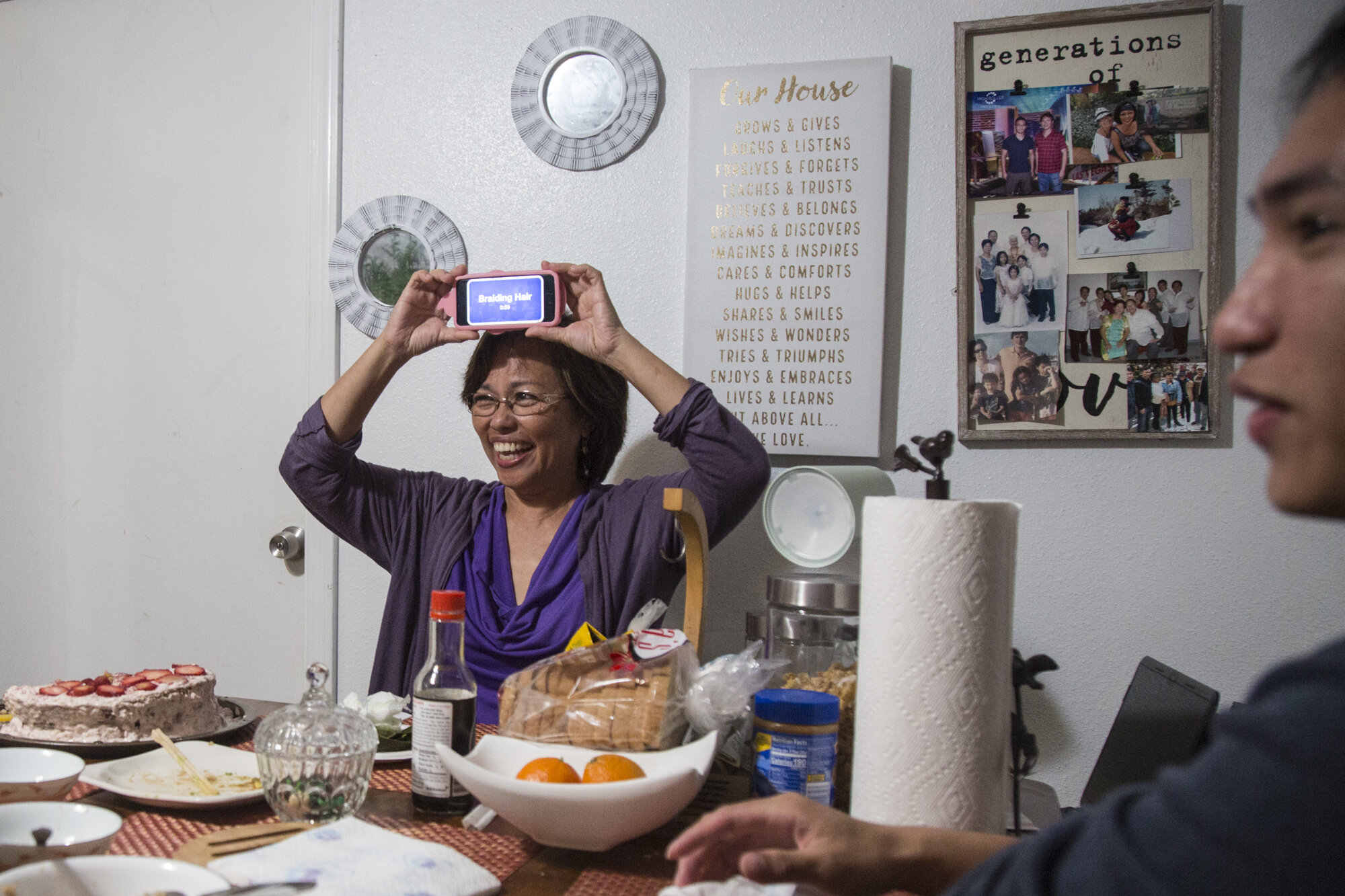  My mom and brother laugh as we play a game of Head’s Up on her 58th birthday. 