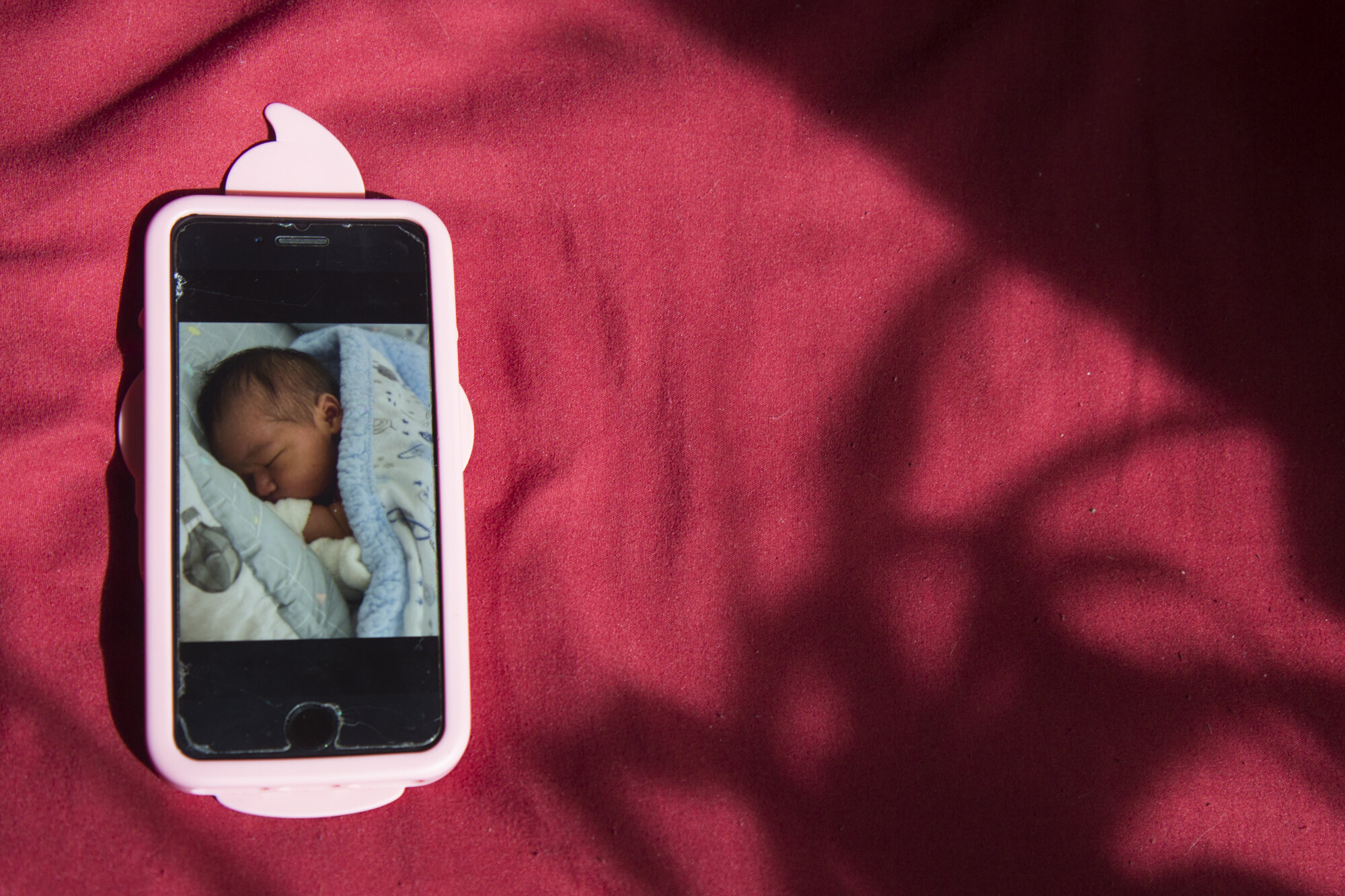  An iPhone picture of my newborn baby cousin, Zavian, sits on my bed. Despite only being 20 minutes away by car, we haven’t been able to see him much since his birth. For about a month, we were limited to FaceTime interactions and pictures sent by hi