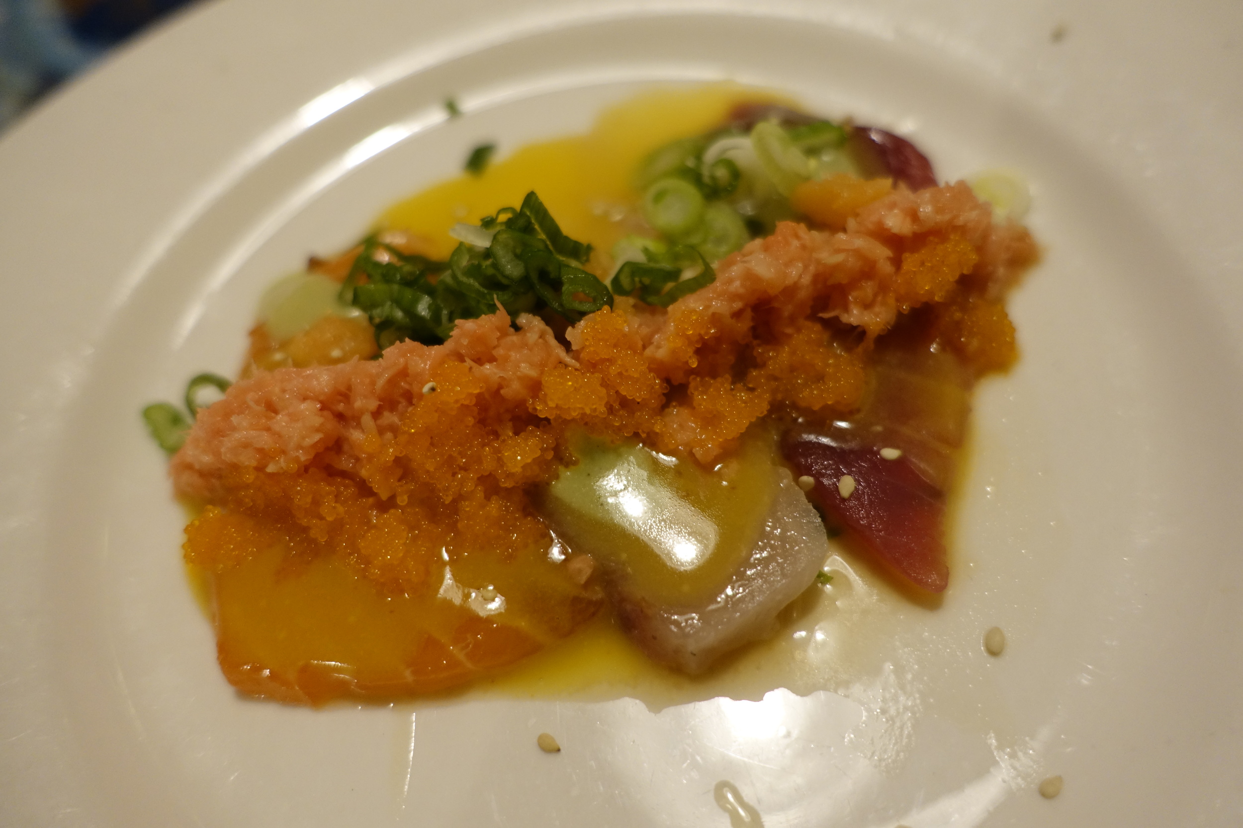 Salmon, yellowtail, and tuna in a creamy miso with salmon roe and grated ginger