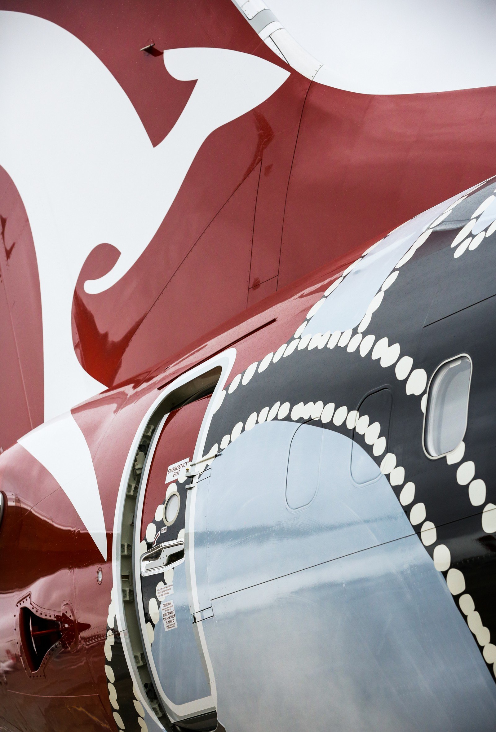 I was lucky enough for the first time in the airline’s 93 year history, change the iconic Qantas tail to be included in the design. The airline’s trademark red tail colour behind the white kangaroo was altered to match the earthy tones of Paddy Bedford’s art work.