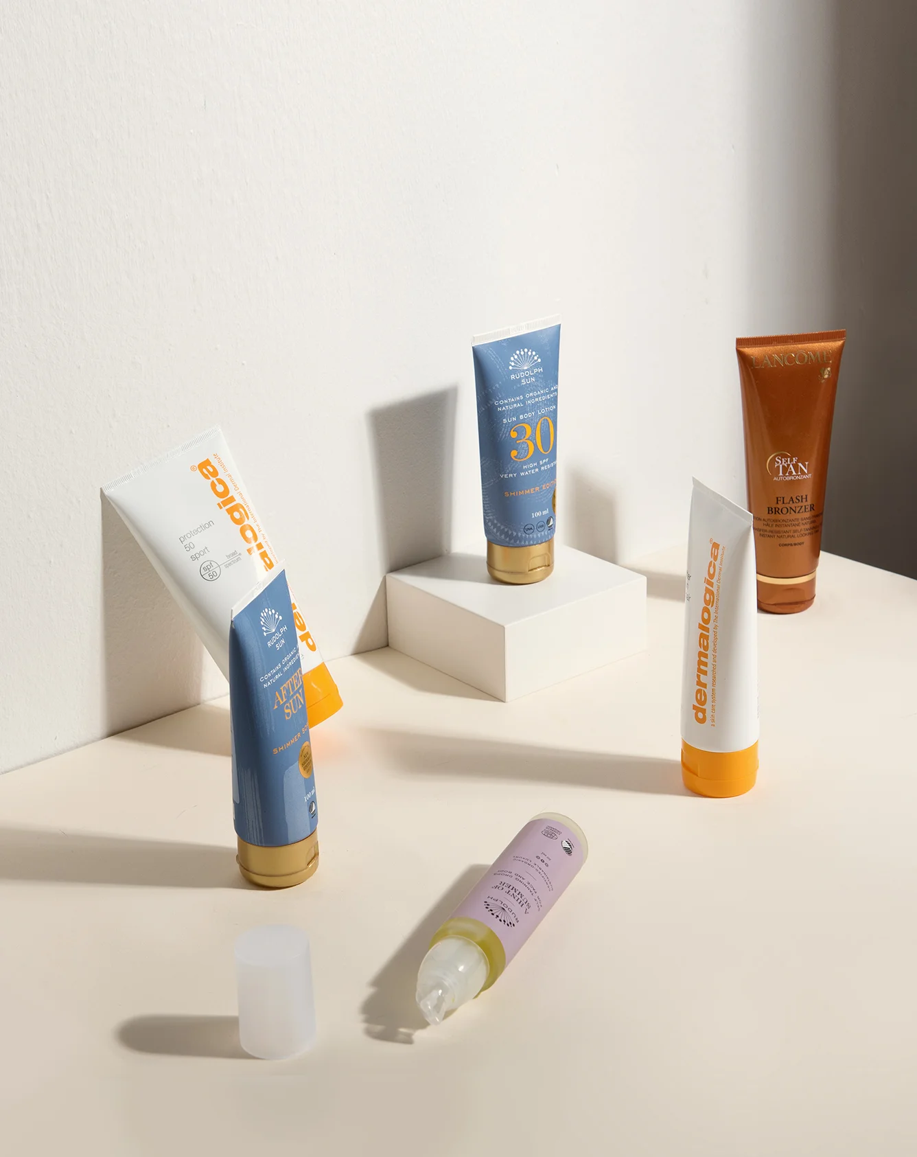 protection 50 sport SPF 50 og after sun repair – DERMALOGICA Aftersun Shimmer Sorbet, Sun Body Lotion Shimmer Edition SPF 30 og A Hint of Summer Self Tanning Drops – RUDOLPH CARE Flash Bronzer Self Tanning Lotion – LANCÔME