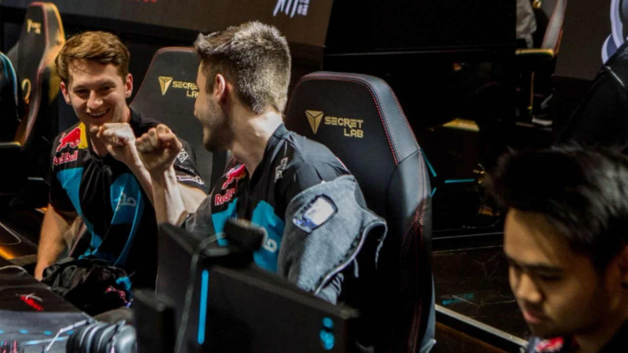 Cloud9 players Lobes (left), Kaymind (middle) and Pr0phie (right) celebrate a win