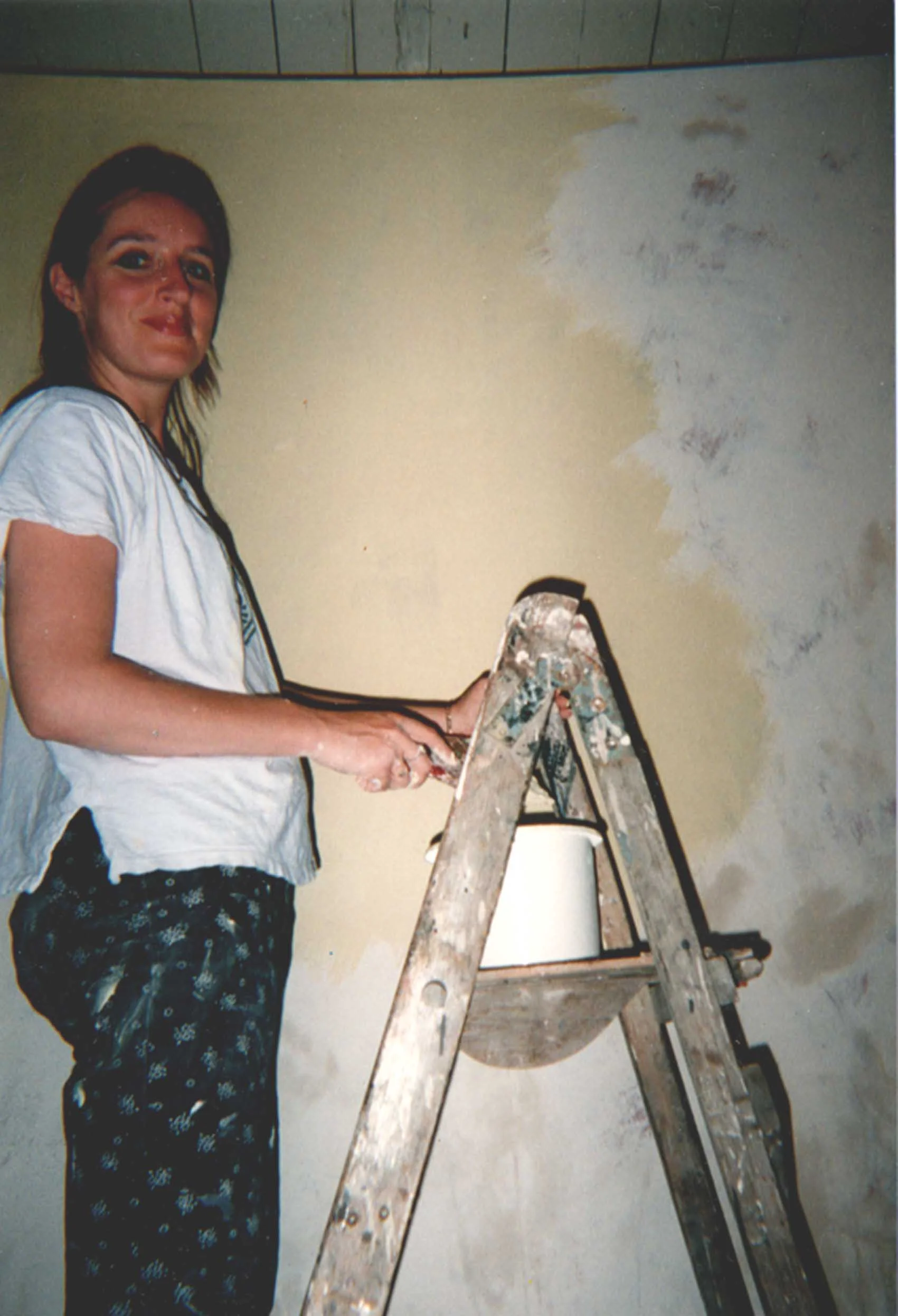 Alice preparing wall for mural
