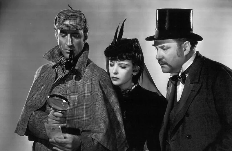 Basil Rathbone (left) as Sherlock Holmes, with Ida Lupino and Nigel Bruce c/o The Arts Desk