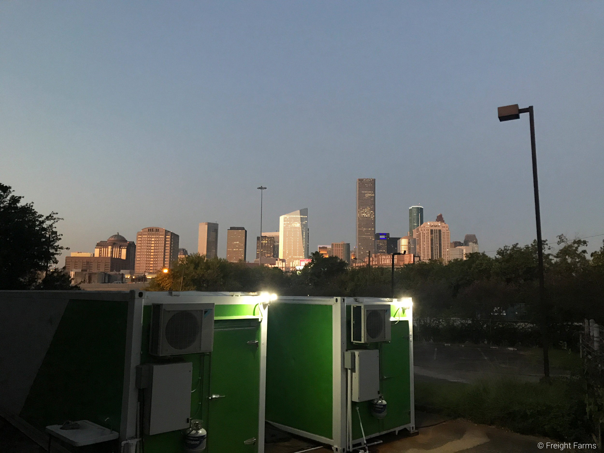 Both Leafy Green Machines with the Houston Skyline