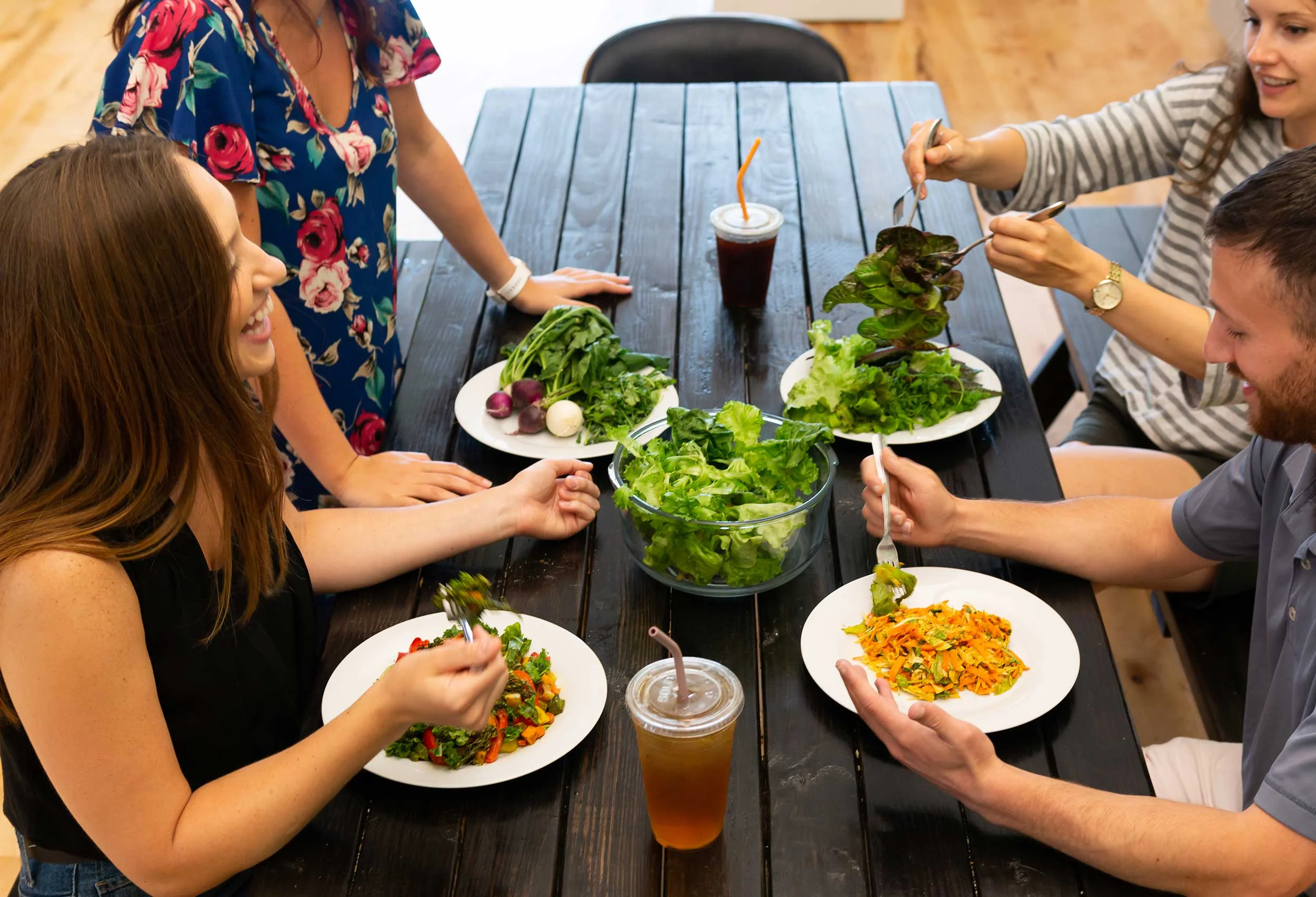 Employees enjoy a healthy lunch with Grown produce harvested from the office farm earlier in the day.