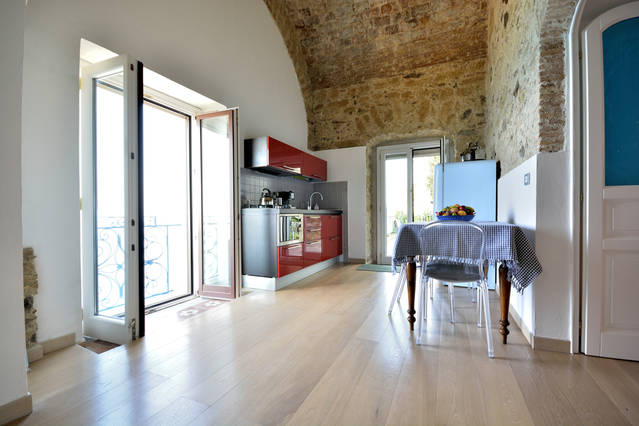 corridor with kitchen and dining area