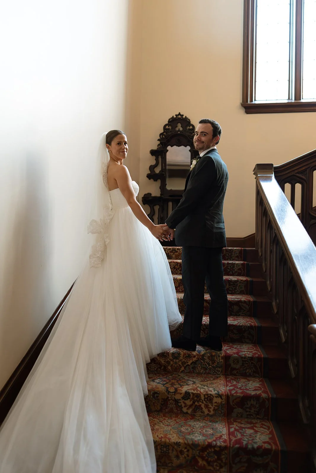 Bride and Groom on Grand Staircase – Elegant Kohl Mansion Wedding | L’Relyea Events