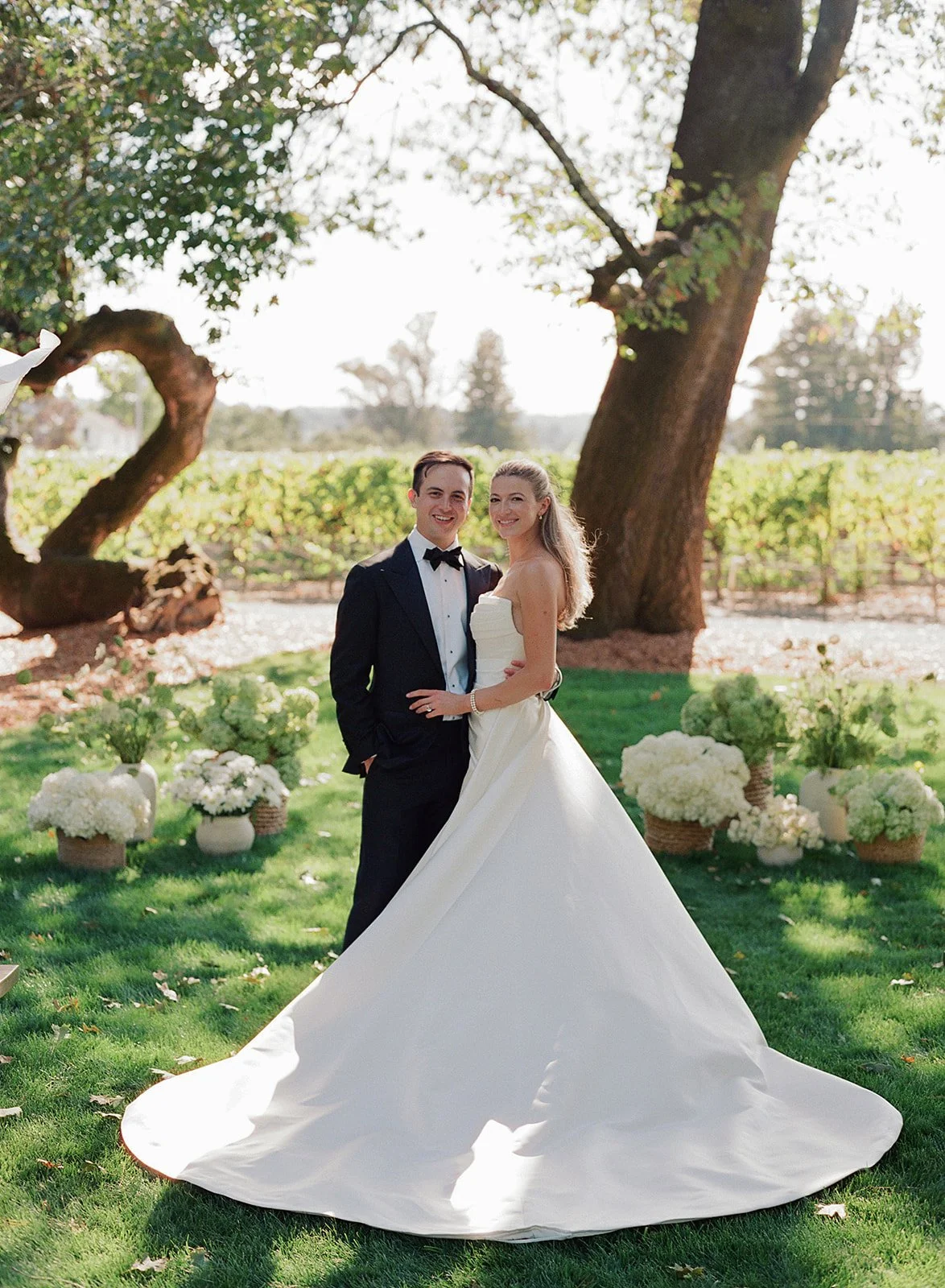 Bride portrait with flowing gown against vineyard backdrop at Oak Grove Estate wedding in Sonoma County, styled by L’Relyea Events.
