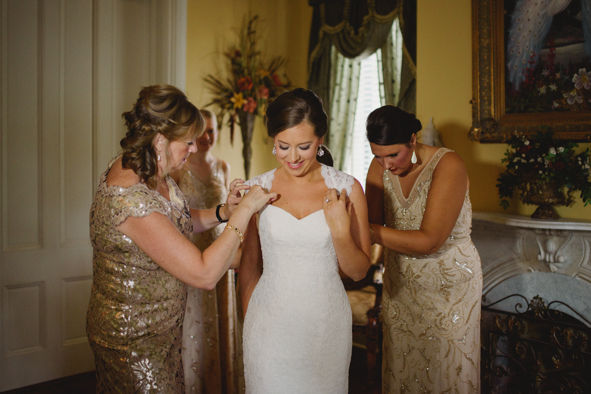 Savannah Photography - Bride getting dresses