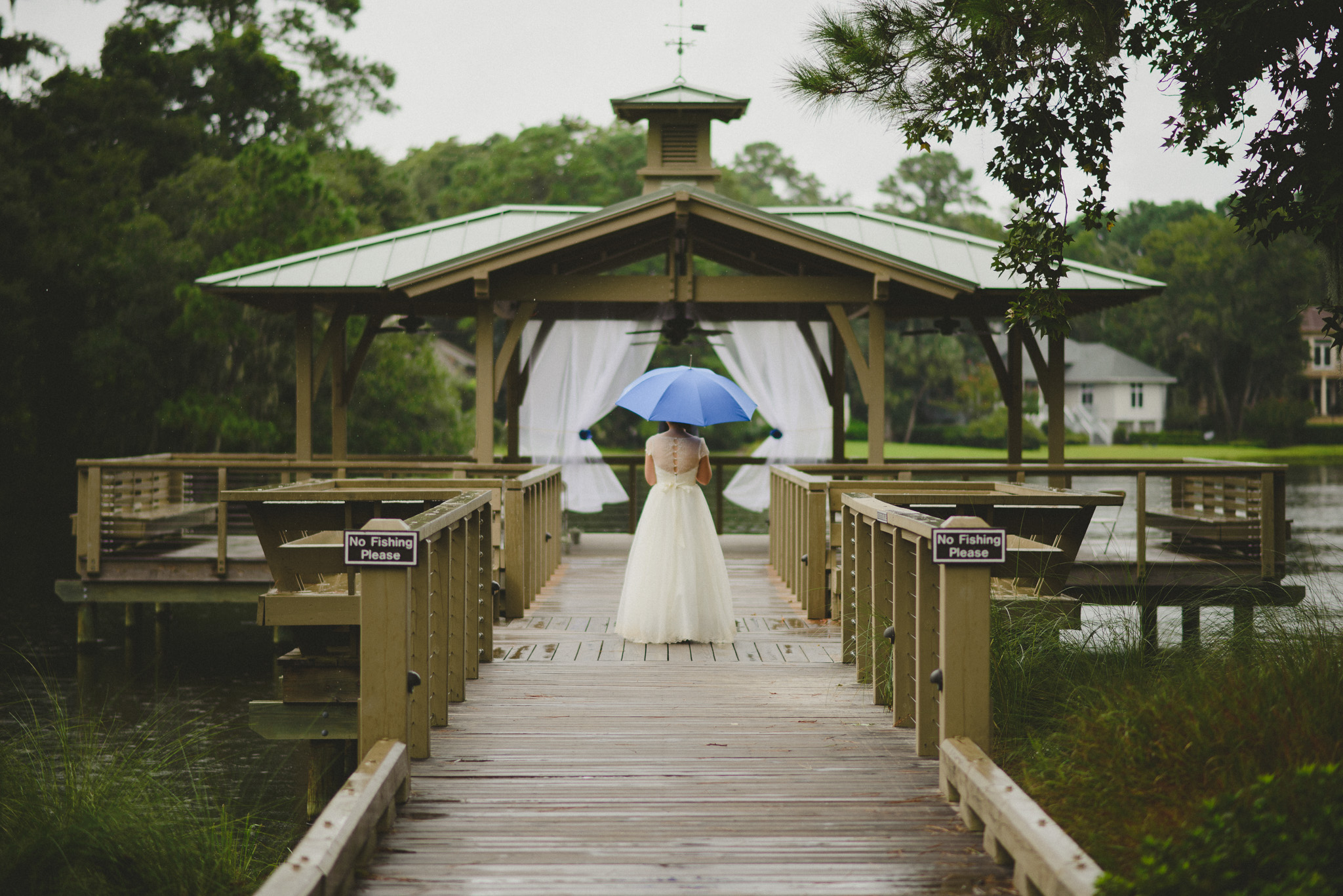 Hilton Head Wedding Photographer - Bride in rain with umbrella