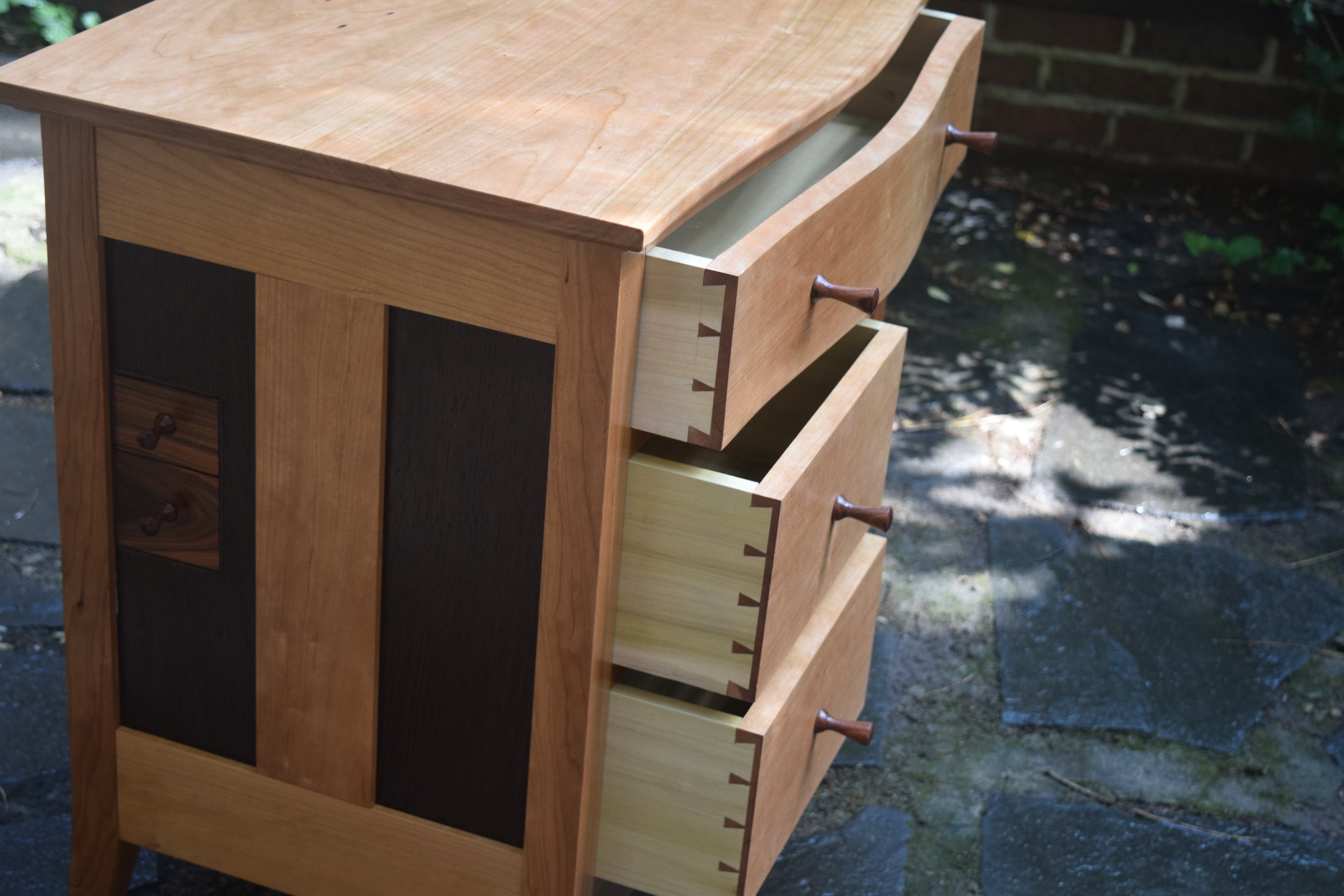   Hand cut dovetails. &nbsp; Each drawer is individually fit to be snug, yet move easily.  