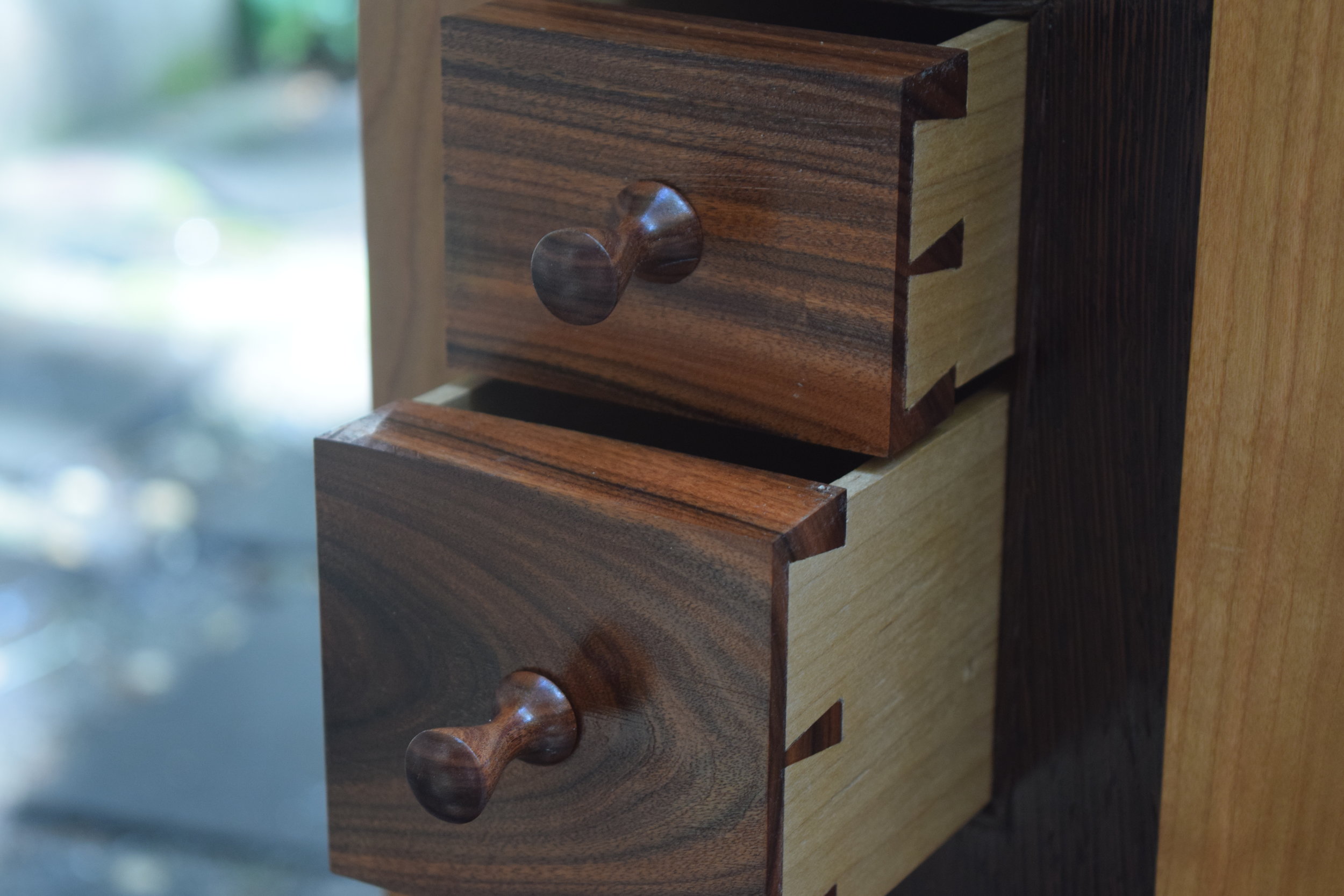   These small rosewood drawers are tucked into the side of a washstand. &nbsp;Hand cut dovetails and turned pulls.  