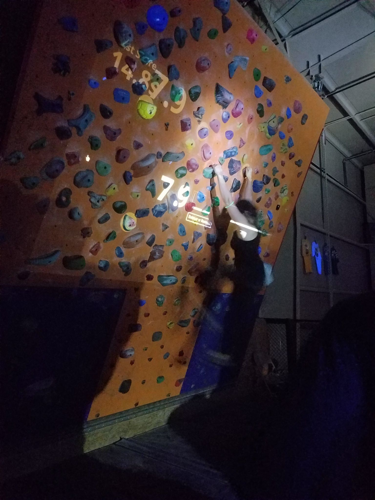 A new feature of the Halloween Blacklight Party: augmented reality bouldering!