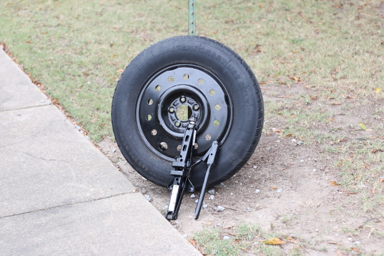  To change a flat, you will need a jack, tire iron, and spare tire. Photos by Braxton Maclean. 