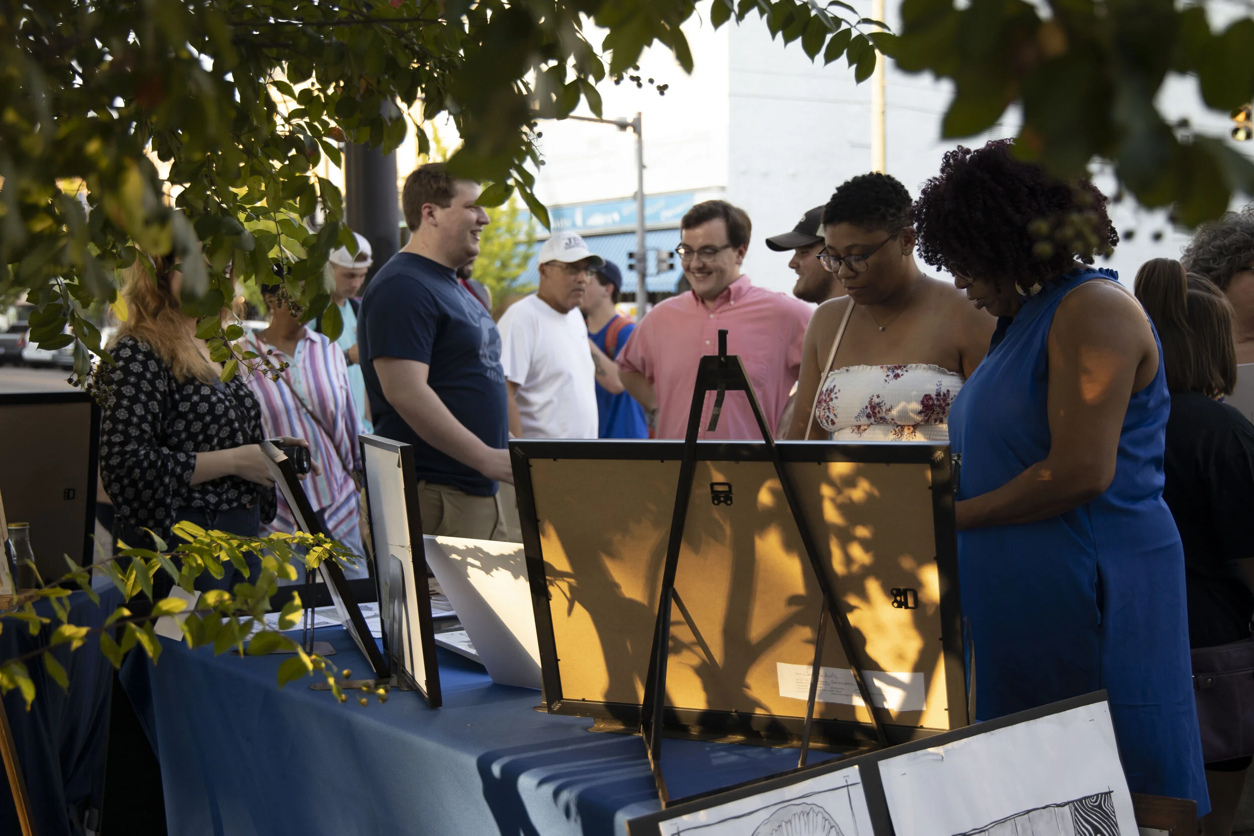 Crowd Around MUW Art Department Table.JPG