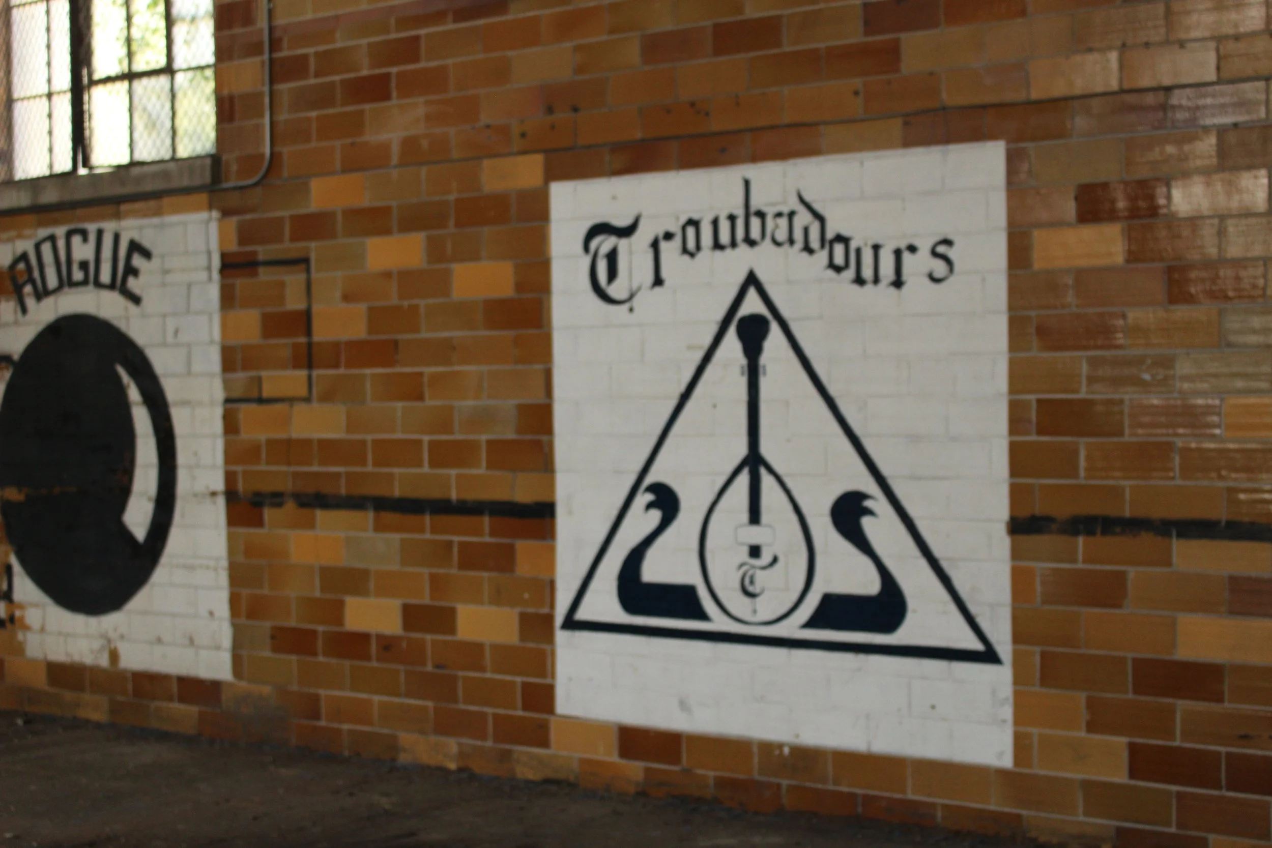  Murals of the Troubadour and Rogue social clubs. While Rogues are no longer active on campus, the Troubadour social club still remains.  