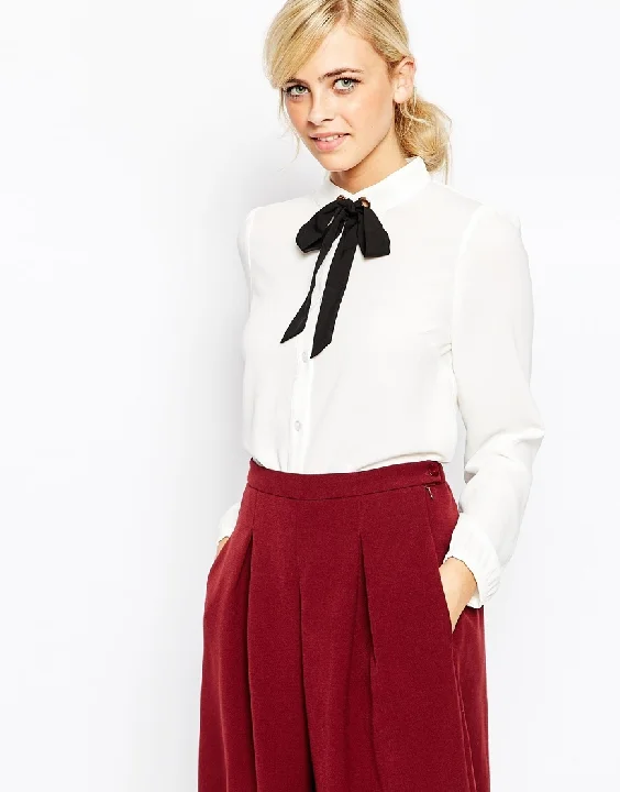 I will never let the necktie go. The chic-est staple of them all...a simple, white blouse. Get it HERE!