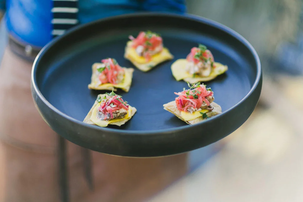 OCTOPUS TOSTADITA with sliced mango and pickled red onion