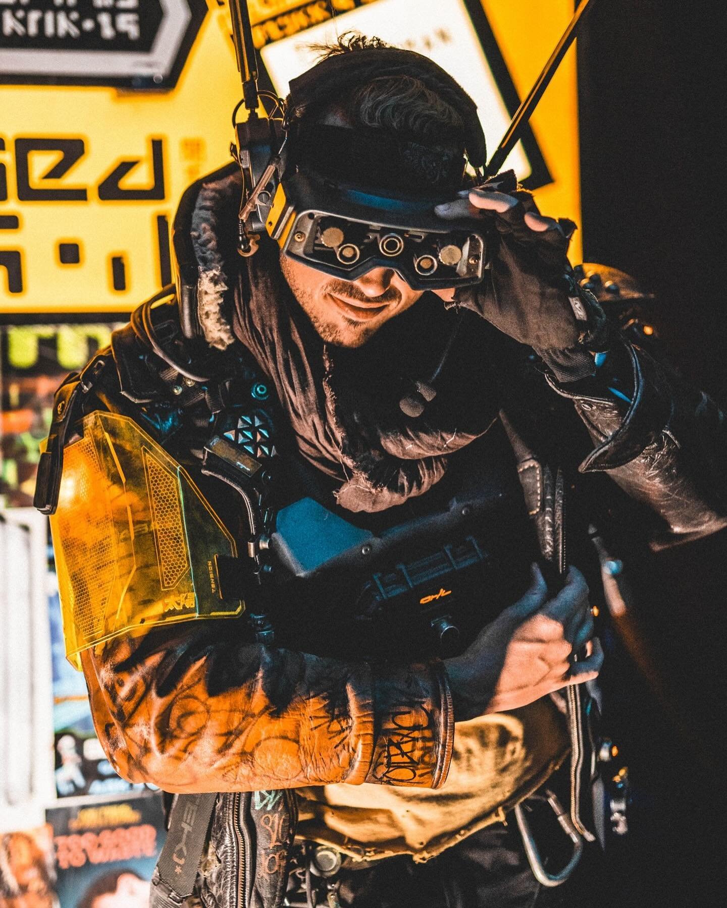 Goggles on or off? 

Slummin&rsquo; outside the Gentleman Loser bar at @neotropolisevent this year. Absolutely love how their frontage is the perfect gritty cyberpunk look at the event. Very stoked to keep working on these goggles too - kitbashed wit