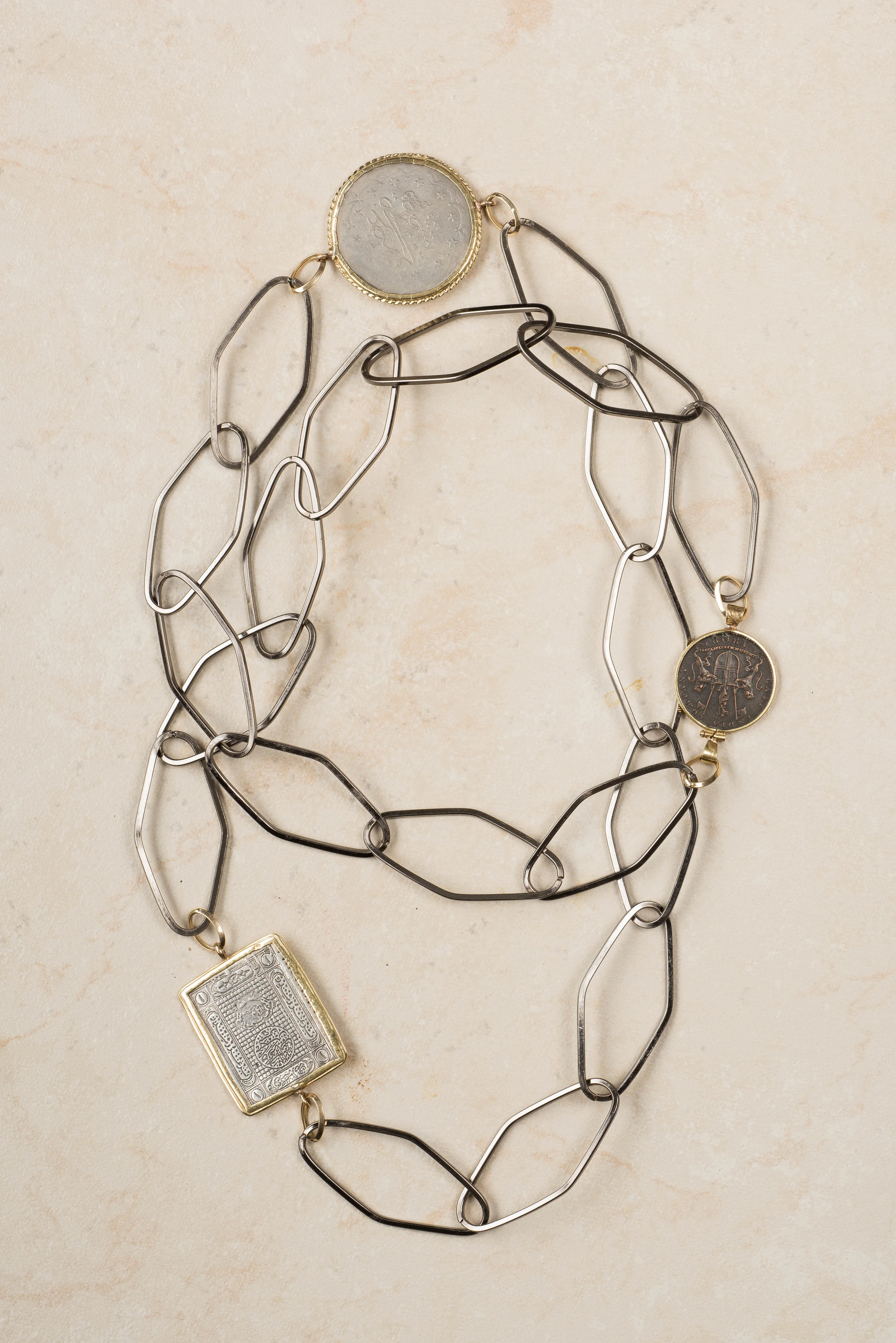 large open steel chain and exotic silver coined trimmed in 14K with 14K gold links/n26