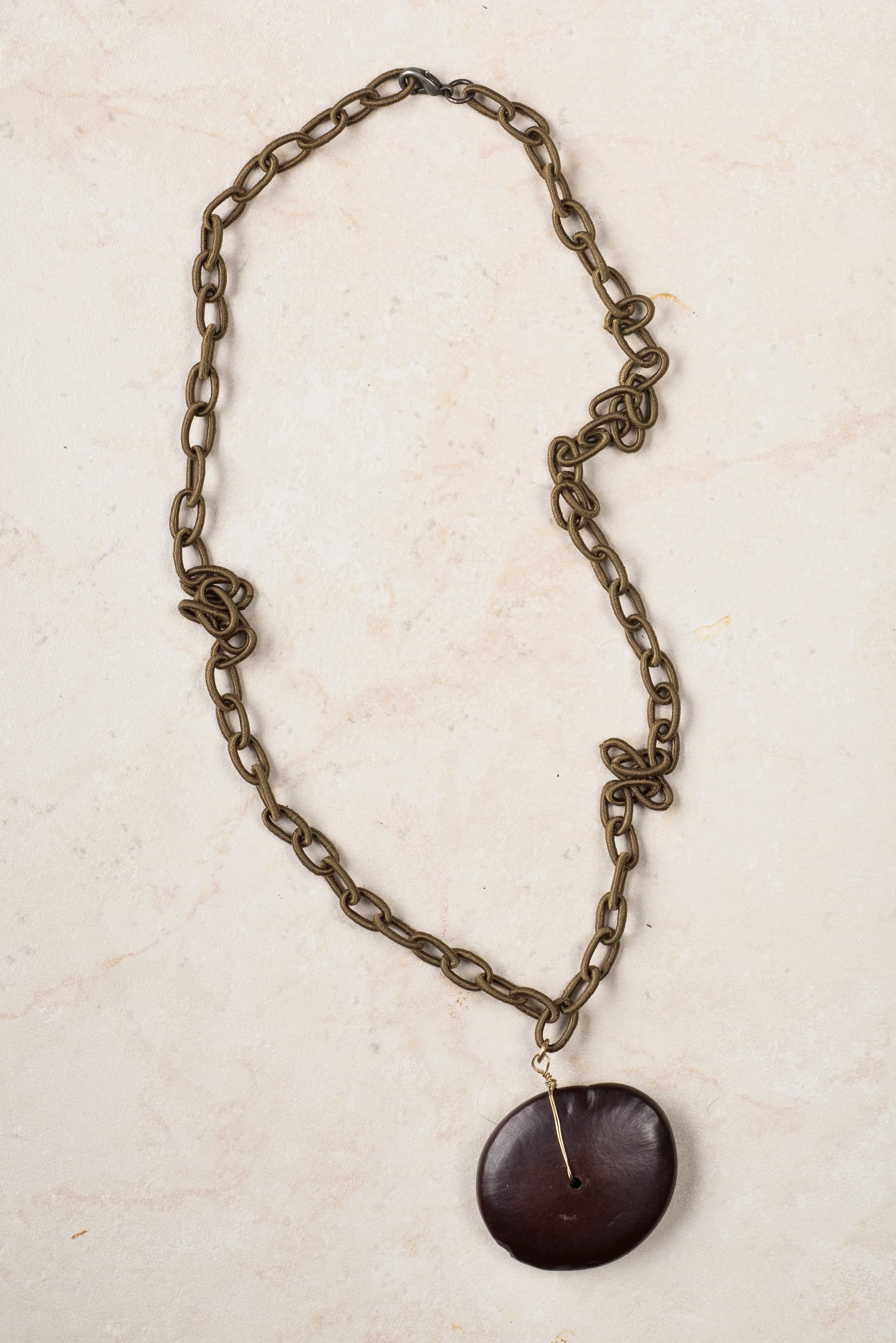 silk chain cord and mahogany charm with 14 carat wire/n99