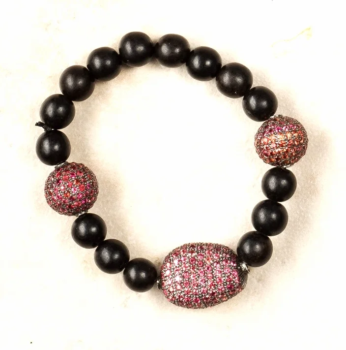 2 ruby pave balls, one ruby pave bean, black wooden beads/stretch/b62