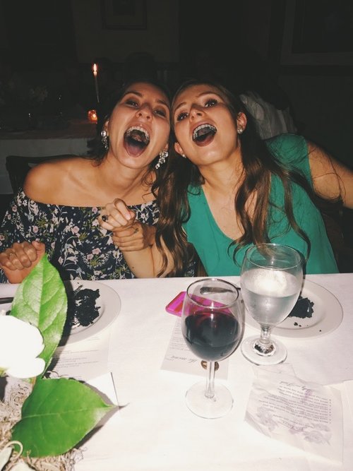 Here I am eating cake at my friend's wedding rehearsal dinner. the cake made our mouths turn a funny color and clearly we needed to capture the moment because we are 5 years old.