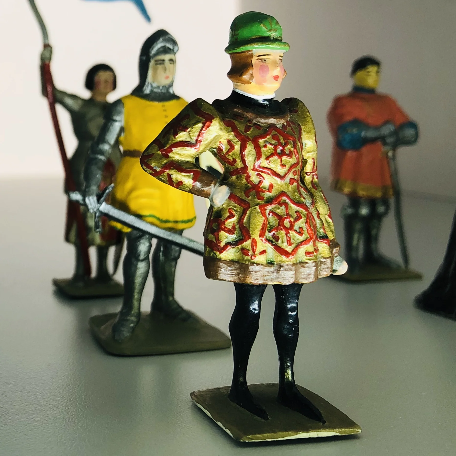 2nd floor, Main Gallery, Various Makers, #6: Vertunni, France, Valois, Charles VI, 20th c. Psychotic Episode of Charles VI Part of the House of Valois On a hot August morning in 1392 a leper in rags accosted King Charles the Beloved in the forest near Le Mans, grabbing his horse's bridle and yelling, “Ride no further, noble king! Turn back! You are betrayed!” Later that afternoon, when a page dropped the king’s lance on a steel helmet, the clanging sound triggered an episode of psychosis in the king, who proceeded to slay four of his own knights and almost killed his own brother, Louis of Orléans. Charles would go on to have delusions that he was made of glass.