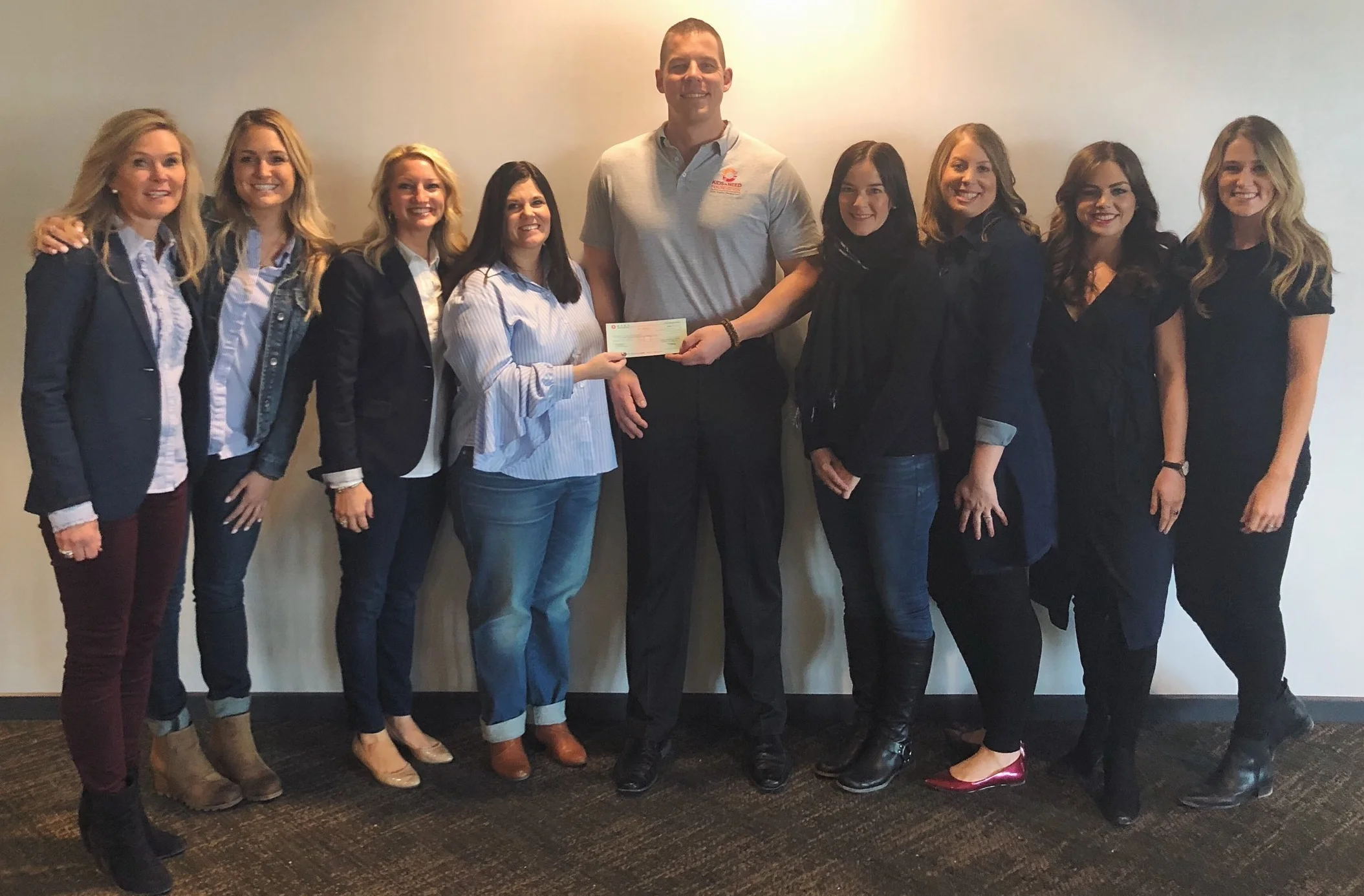 Presenting Jeff from Kids in Need with a check on behalf of one our amazing vendor partners!