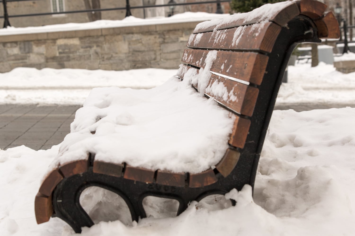 Snow covered bench in Old Montreal 